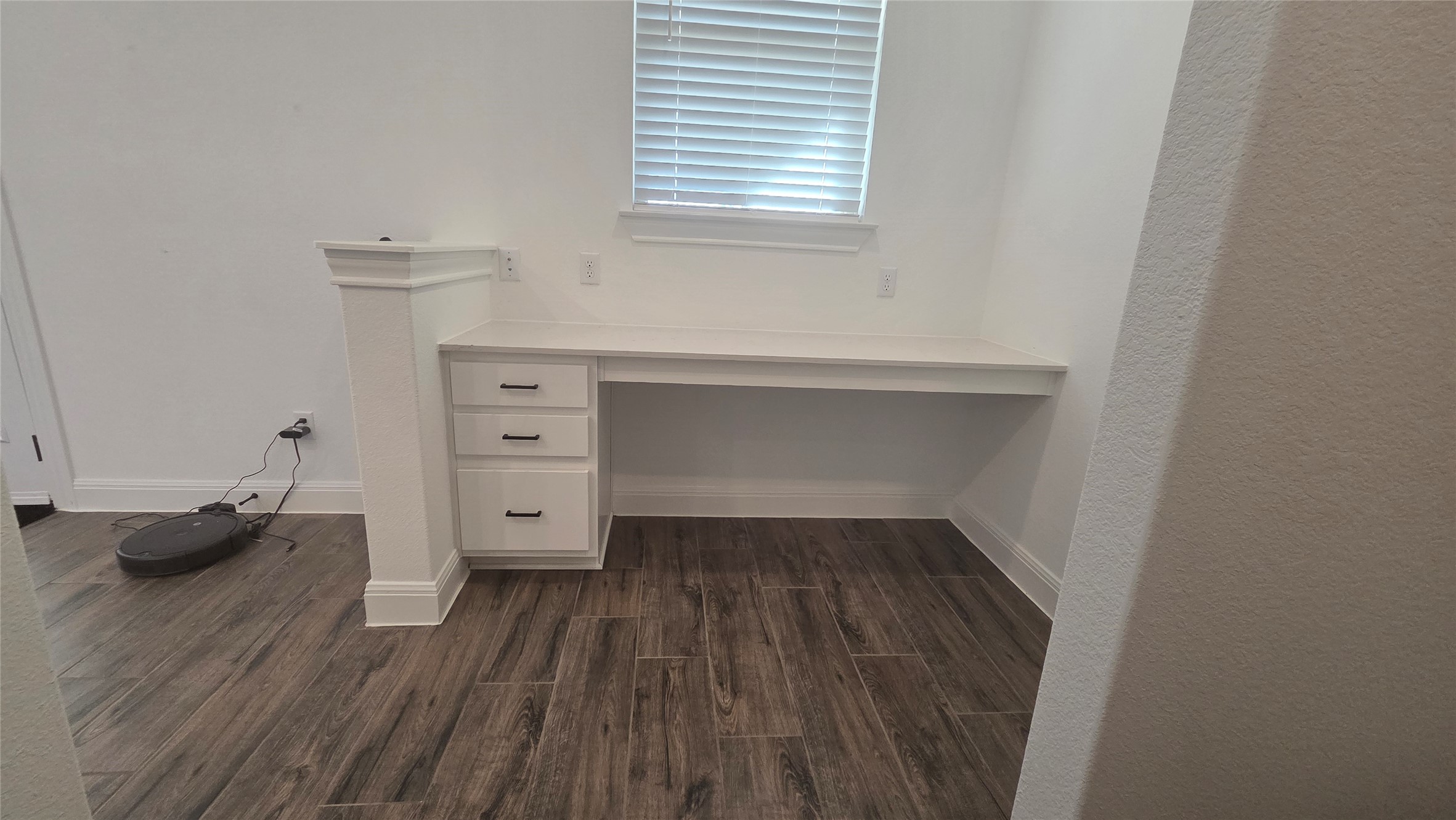 125 Raleigh Drive Georgetown, TX 78633 - Photo 9 of 30 Unfurnished office with dark wood-type flooring and built in desk