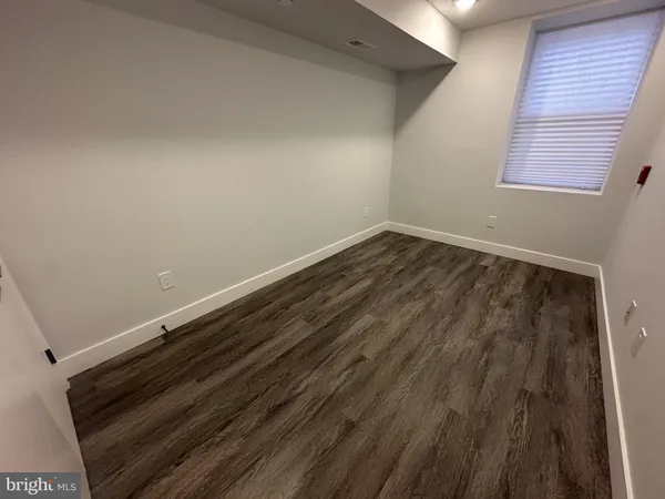a view of wooden floor in an empty room