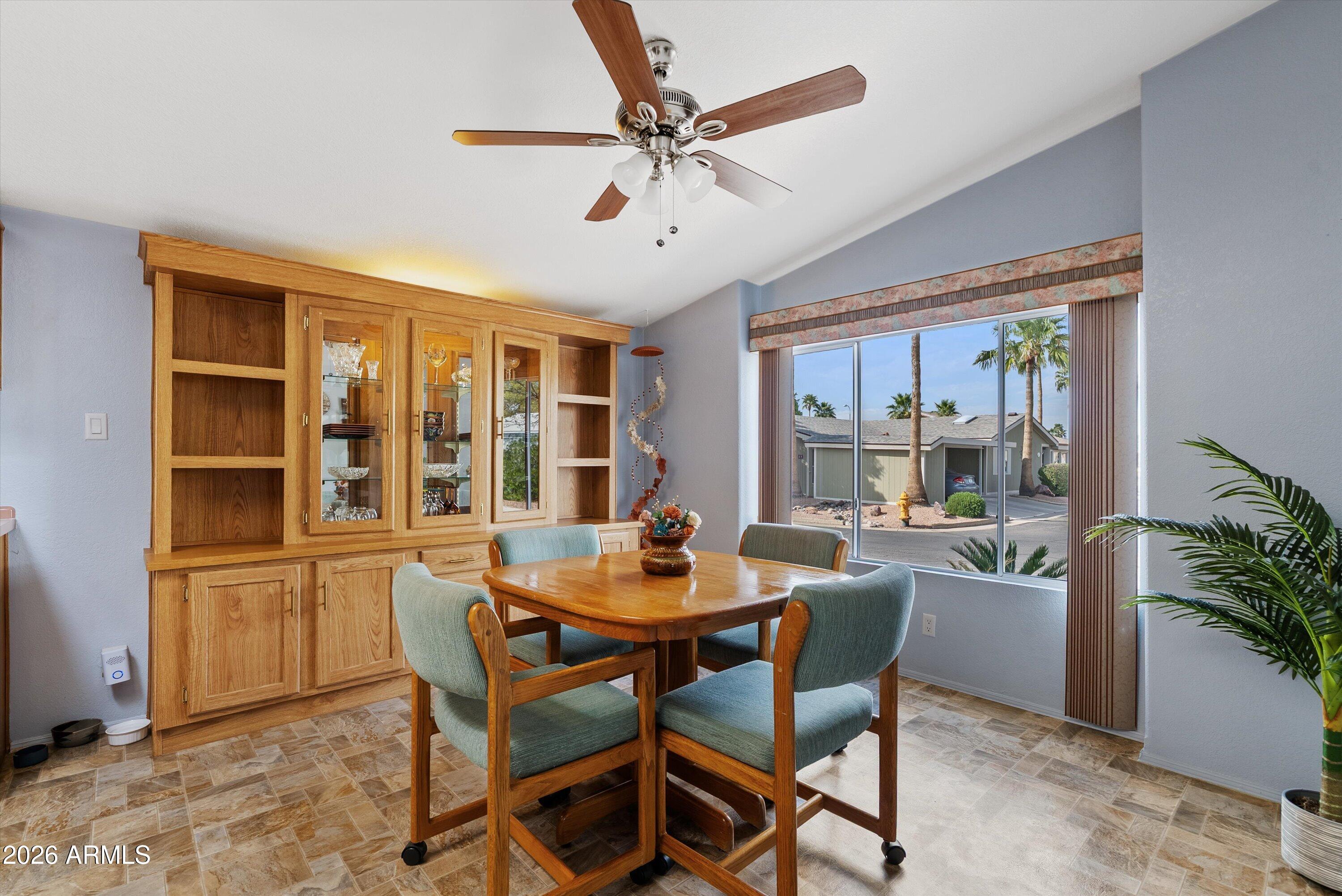 3700 South Tomahawk Road, Unit 91 Apache Junction, AZ 85119 - Photo 6 of 29 a dining room with furniture and window