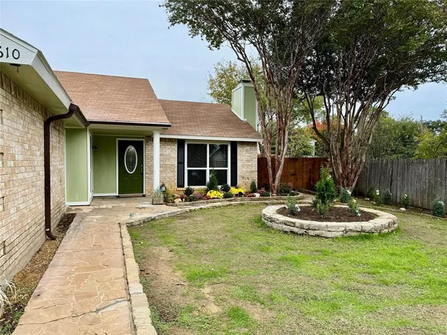 a view of a house with swimming pool and sitting area