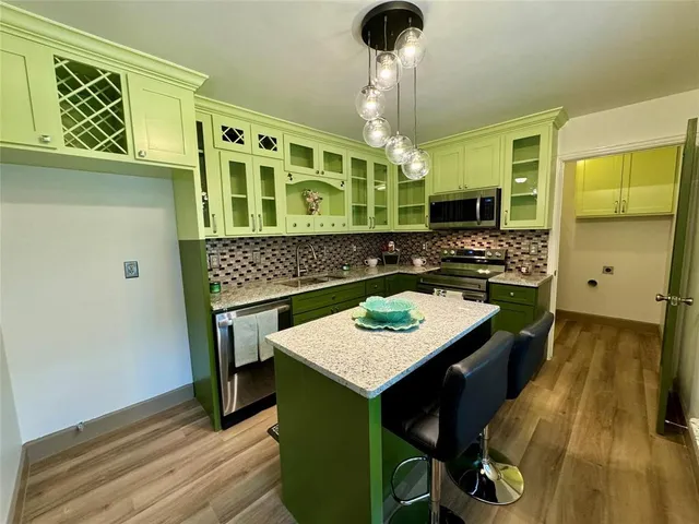 a kitchen with sink and window