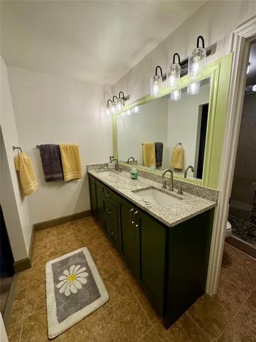 a bathroom with a tub and a glass door