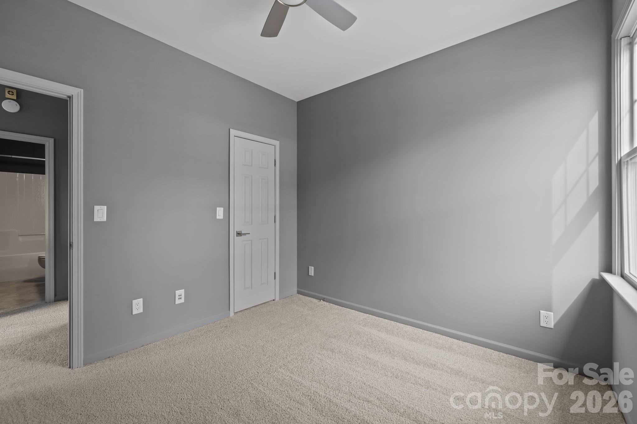 173 Blandina Court, Unit 426 Fort Mill, SC 29708 - Photo 19 of 32 an empty room with a ceiling fan and a rug
