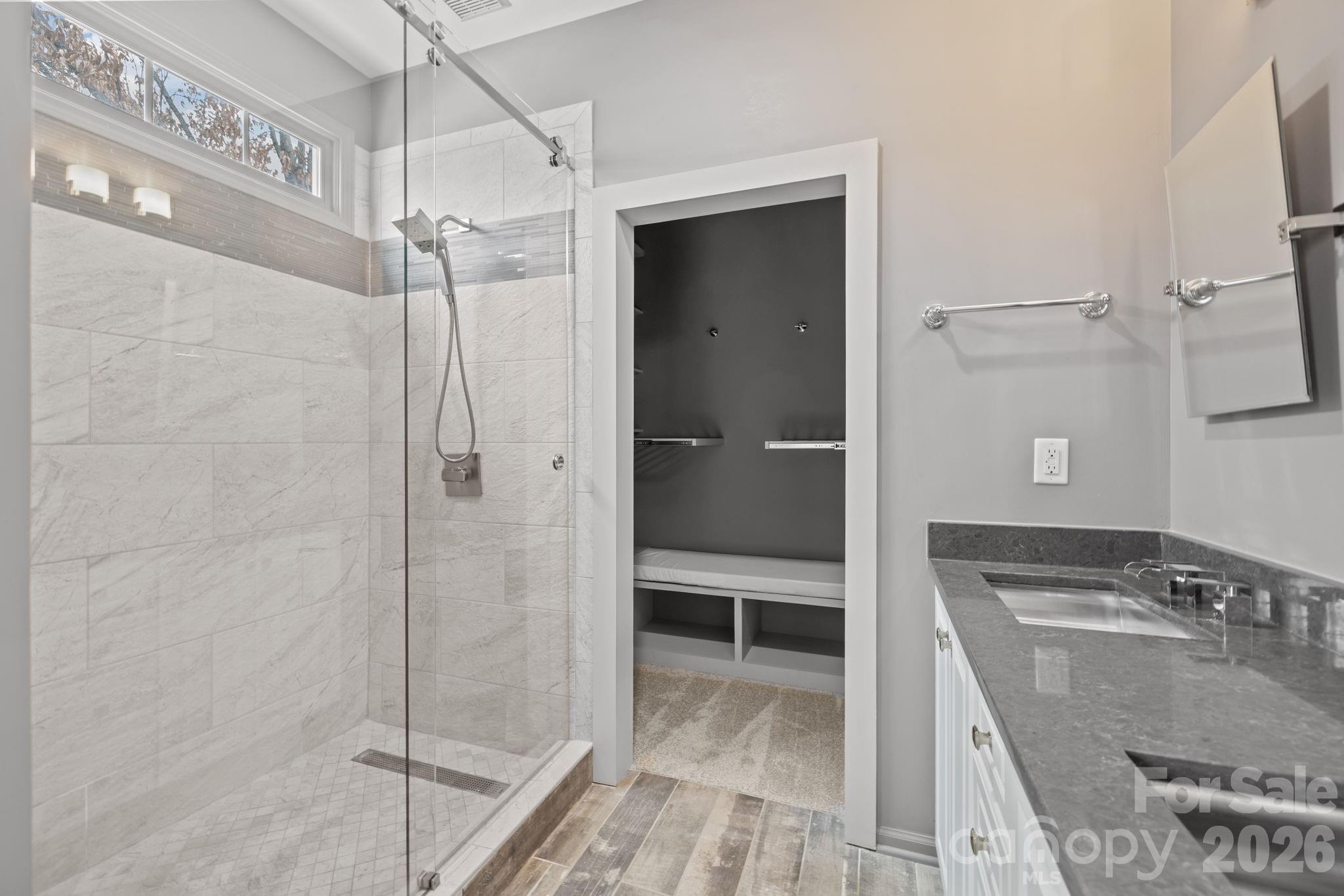 173 Blandina Court, Unit 426 Fort Mill, SC 29708 - Photo 24 of 32 a bathroom with a granite countertop double vanity and a shower