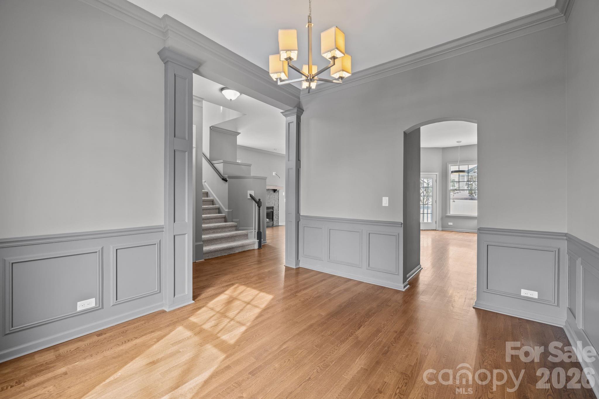 173 Blandina Court, Unit 426 Fort Mill, SC 29708 - Photo 4 of 32 a view of a hallway with wooden floor and staircase