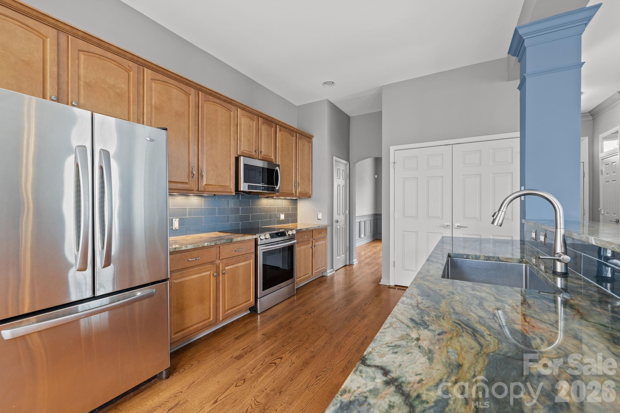 173 Blandina Court, Unit 426 Fort Mill, SC 29708 - Photo 6 of 32 a kitchen with stainless steel appliances a refrigerator sink and cabinets