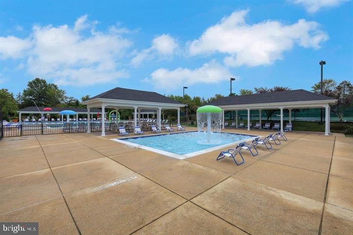 9817 Solar Course Laurel, MD 20723 - Photo 41 of 59 a view of a patio with a table and chairs
