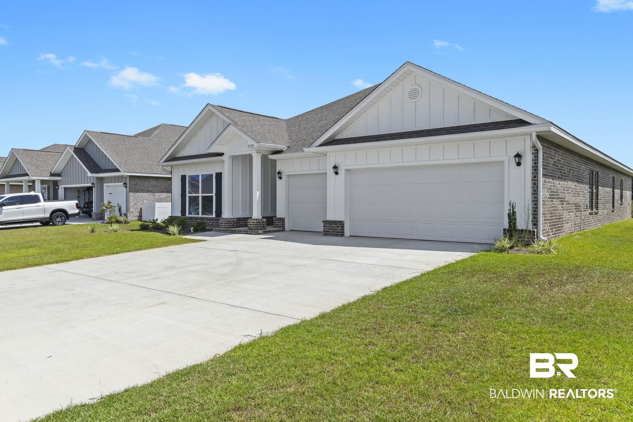 11303 Genuine Risk Circle Daphne, AL 36526 - Photo 6 of 100 View of front of property with a garage and a front lawn