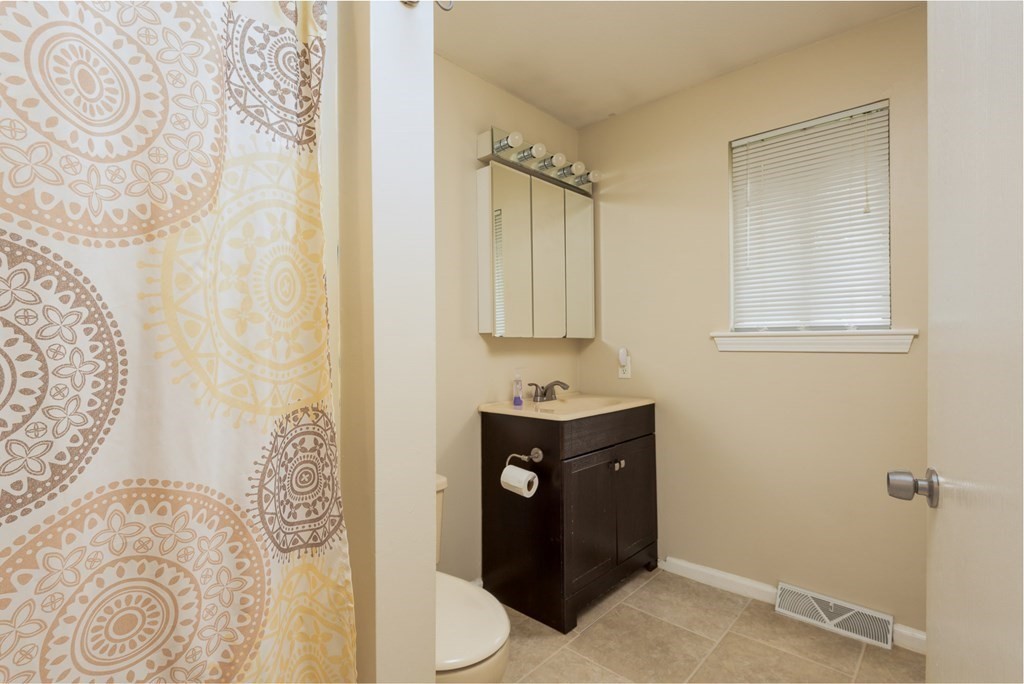 13 Mountain Gate Road, Unit 13 Ashland, MA 01721 - Photo 13 of 21 a view of bathroom with a sink and mirror