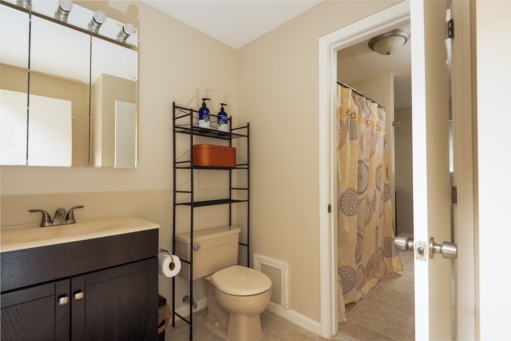 13 Mountain Gate Road, Unit 13 Ashland, MA 01721 - Photo 14 of 21 a bathroom with a sink toilet and shower