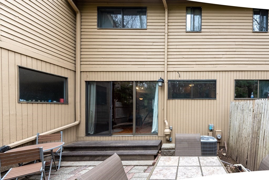 13 Mountain Gate Road, Unit 13 Ashland, MA 01721 - Photo 17 of 21 a view of a house with a patio