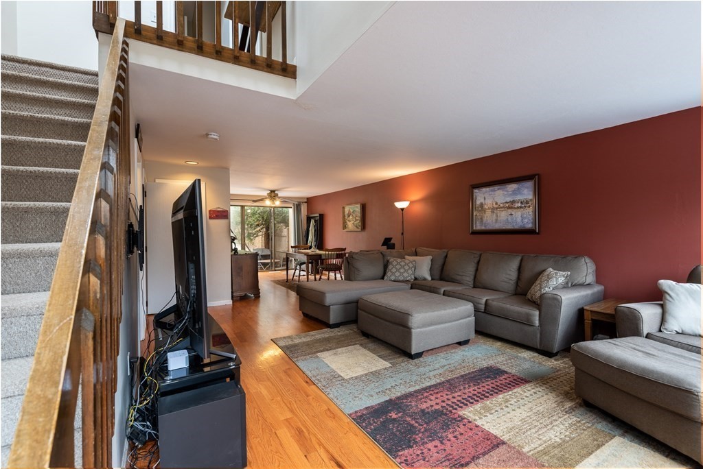 13 Mountain Gate Road, Unit 13 Ashland, MA 01721 - Photo 2 of 21 a living room with couches and a flat screen tv
