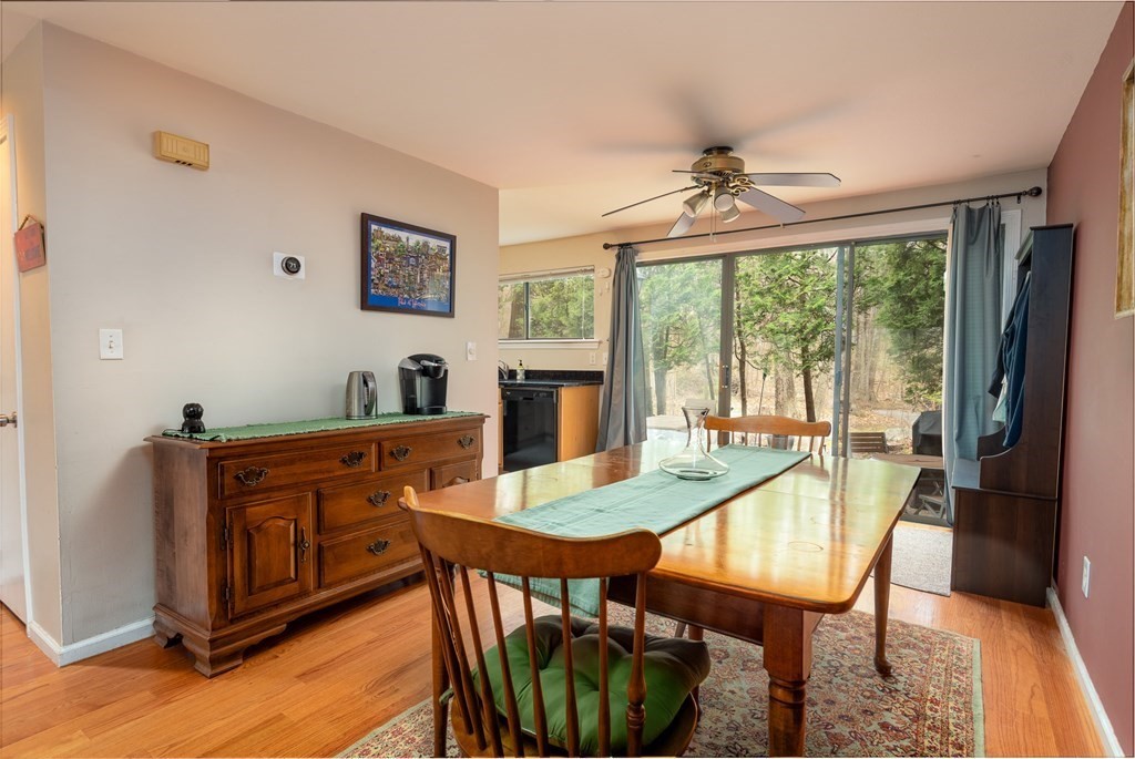 13 Mountain Gate Road, Unit 13 Ashland, MA 01721 - Photo 4 of 21 a dining room with furniture a chandelier and wooden floor