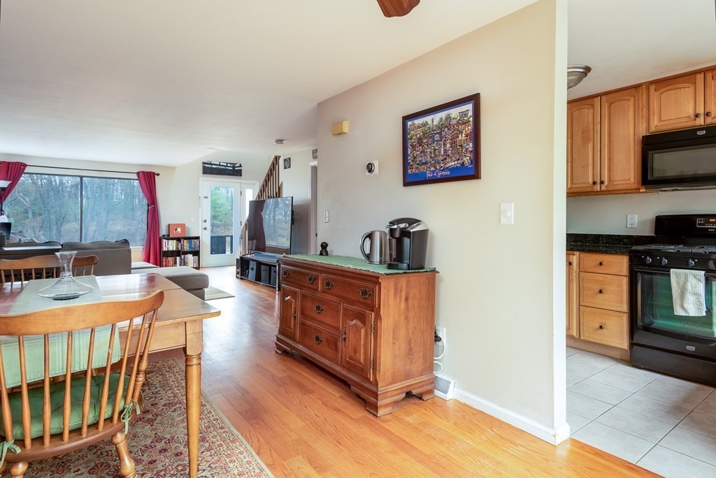 13 Mountain Gate Road, Unit 13 Ashland, MA 01721 - Photo 8 of 21 a large kitchen with stainless steel appliances granite countertop a stove a sink and a refrigerator