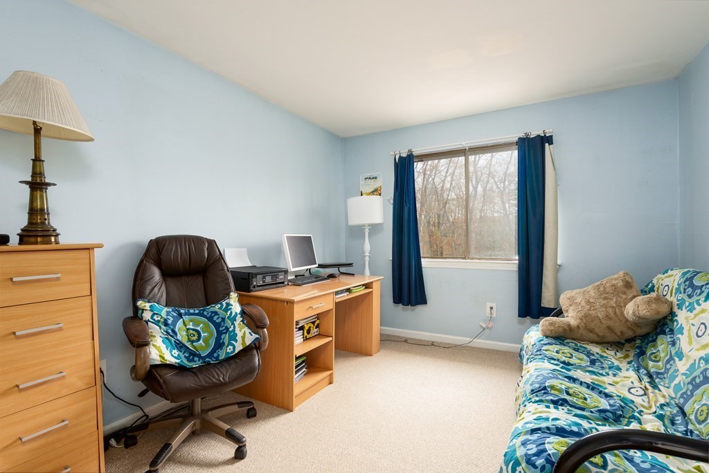 13 Mountain Gate Road, Unit 13 Ashland, MA 01721 - Photo 9 of 21 a room with furniture and a window