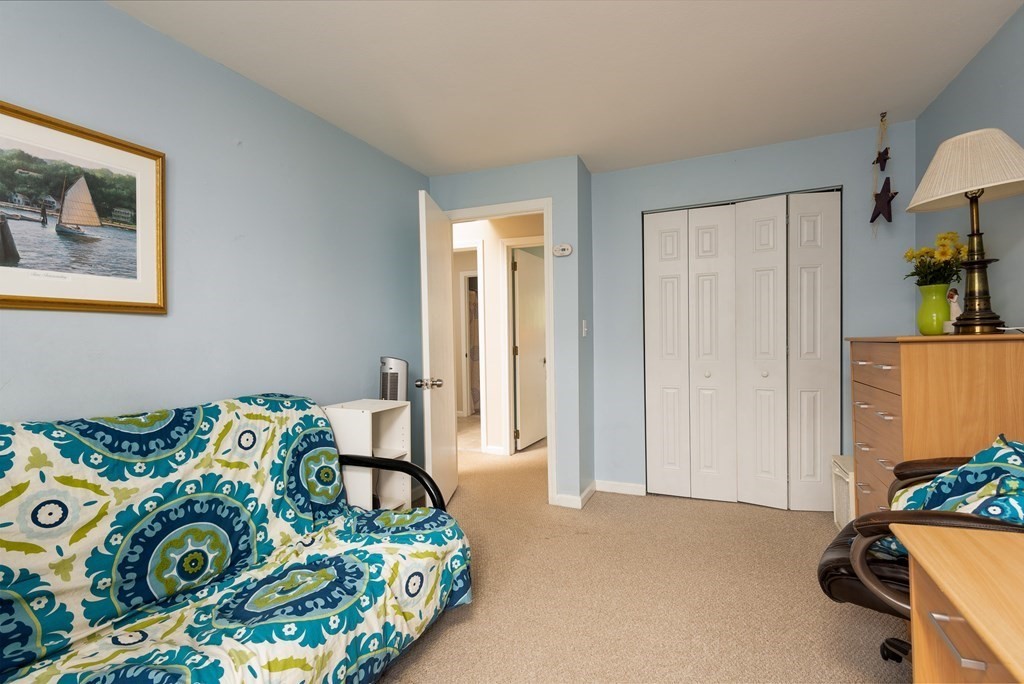 13 Mountain Gate Road, Unit 13 Ashland, MA 01721 - Photo 10 of 21 a bedroom with bed and a window