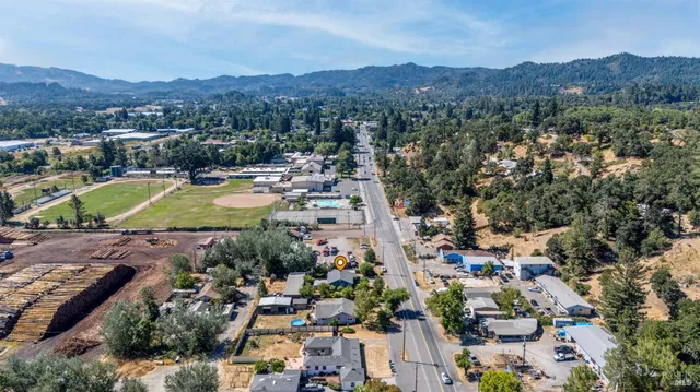 an aerial view of residential house and sandy dunes