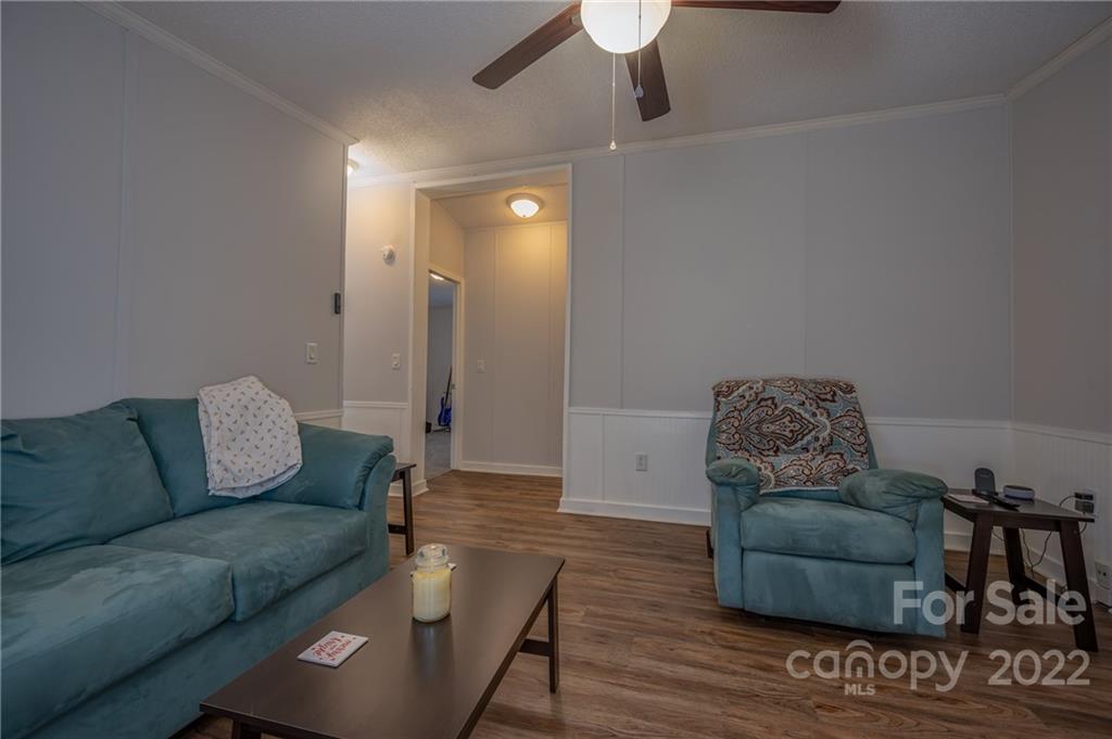 1139 Piney Knob Road Rutherfordton, NC 28139 - Photo 21 of 37 a living room with furniture and a wooden floor