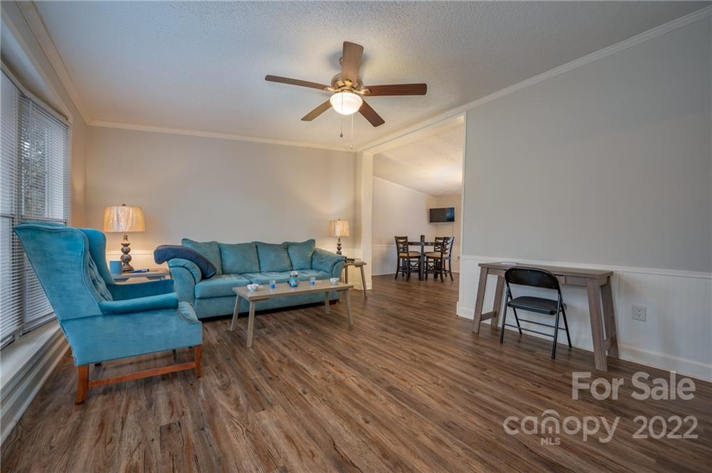 1139 Piney Knob Road Rutherfordton, NC 28139 - Photo 8 of 37 a living room with furniture and a wooden floor