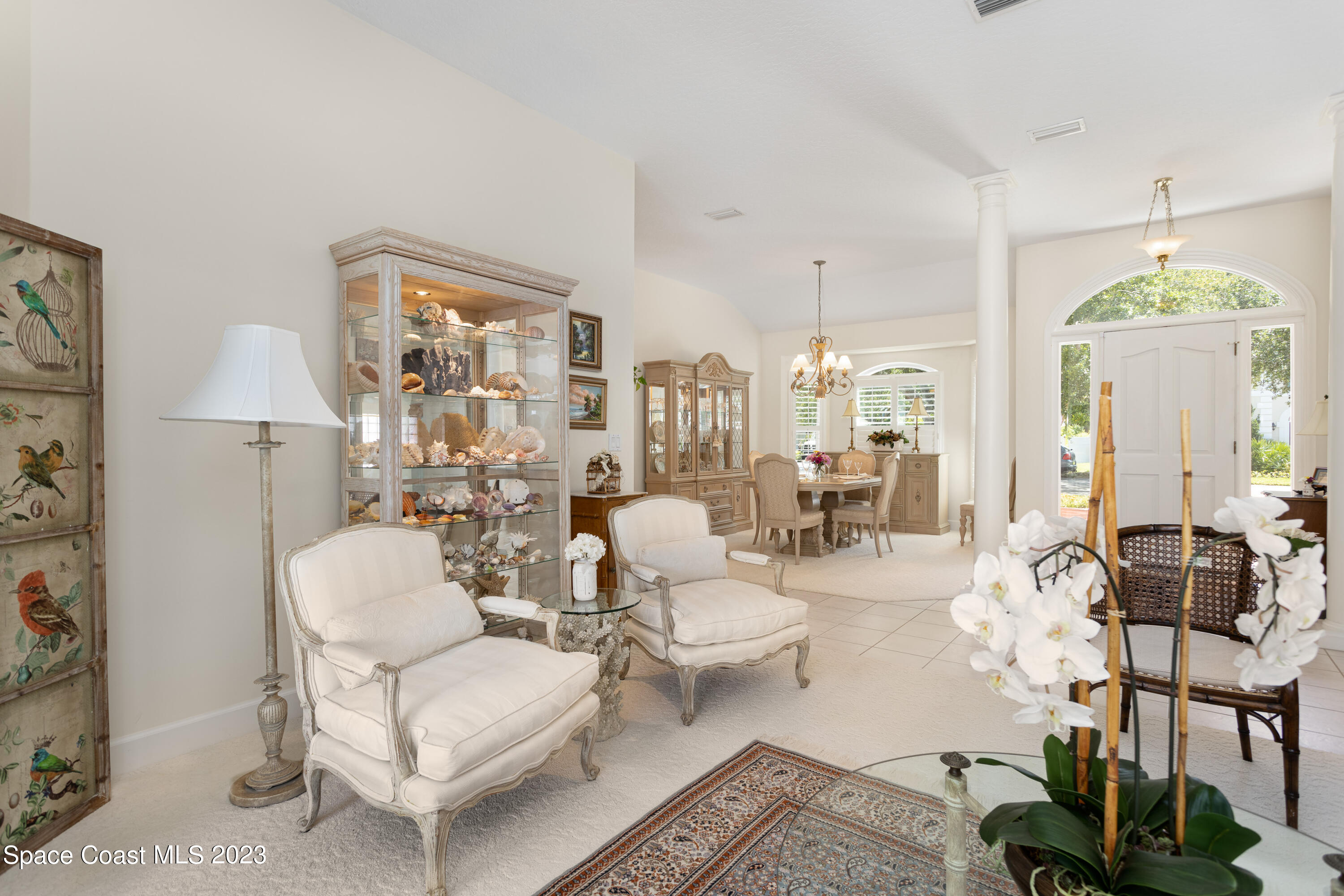442 Sanderling Drive Indialantic, FL 32903 - Photo 11 of 45 a living room with furniture and a chandelier