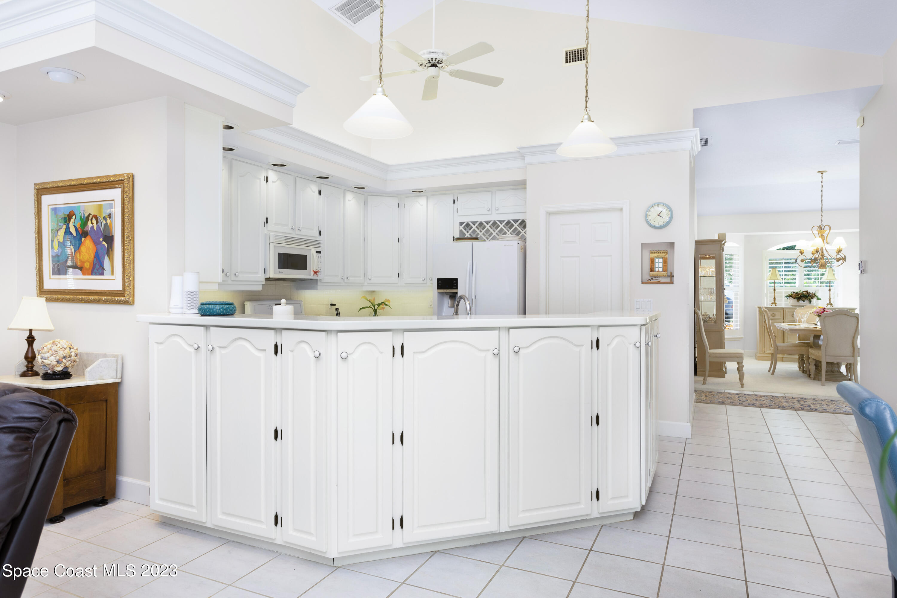 442 Sanderling Drive Indialantic, FL 32903 - Photo 13 of 45 a kitchen with stainless steel appliances cabinets and a window