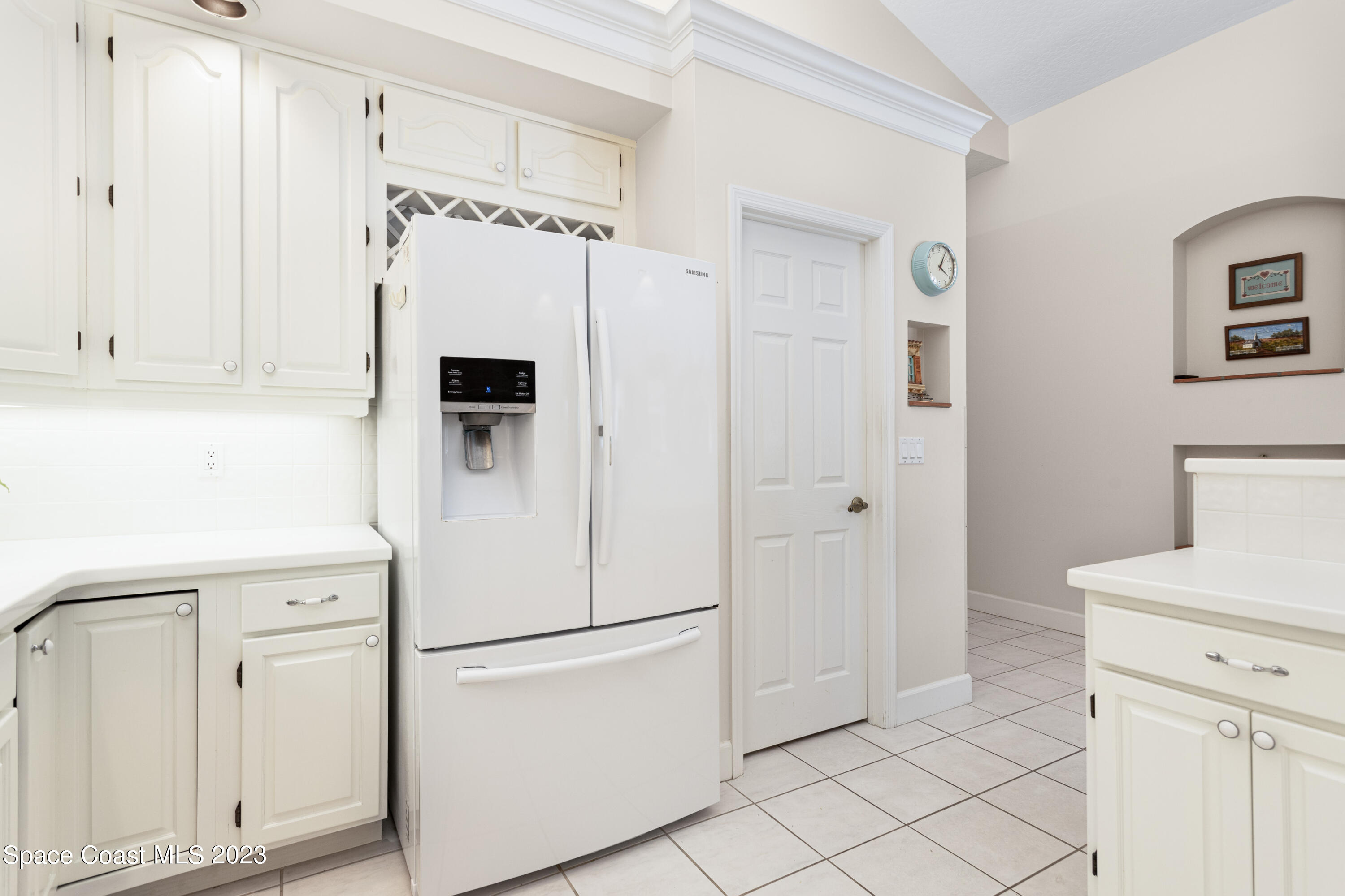 442 Sanderling Drive Indialantic, FL 32903 - Photo 14 of 45 a white refrigerator freezer and a dishwasher in a kitchen