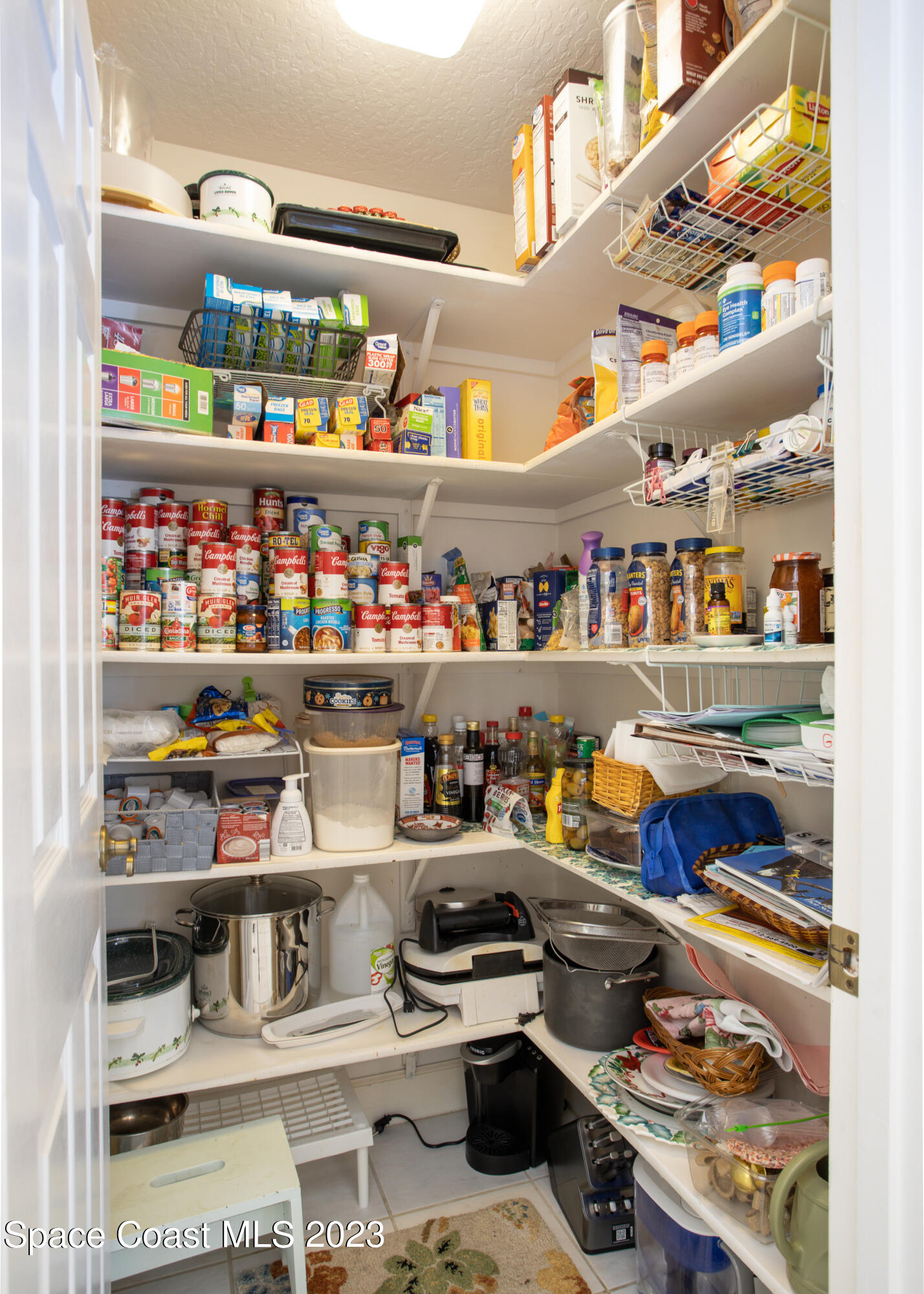 442 Sanderling Drive Indialantic, FL 32903 - Photo 17 of 45 a room with lots of different colored cloths