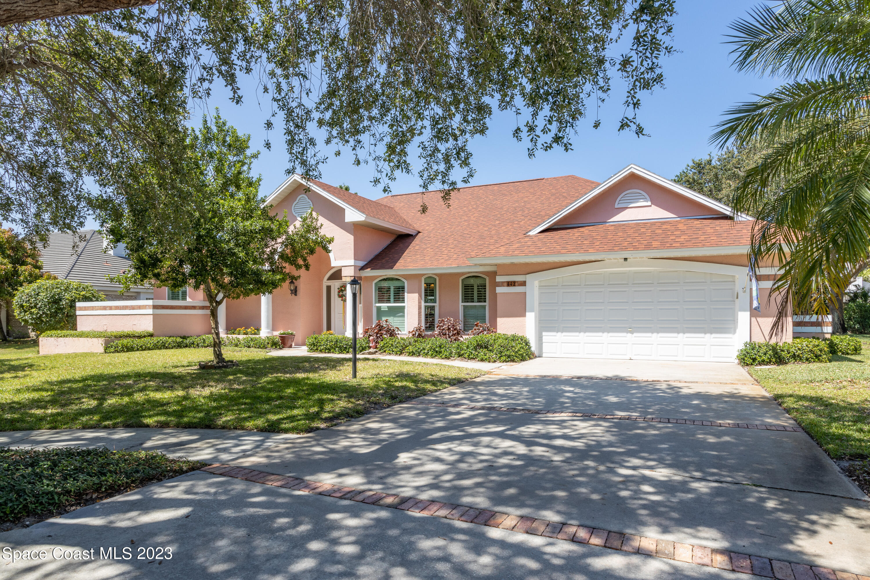 442 Sanderling Drive Indialantic, FL 32903 - Photo 2 of 45 a front view of a house with a yard