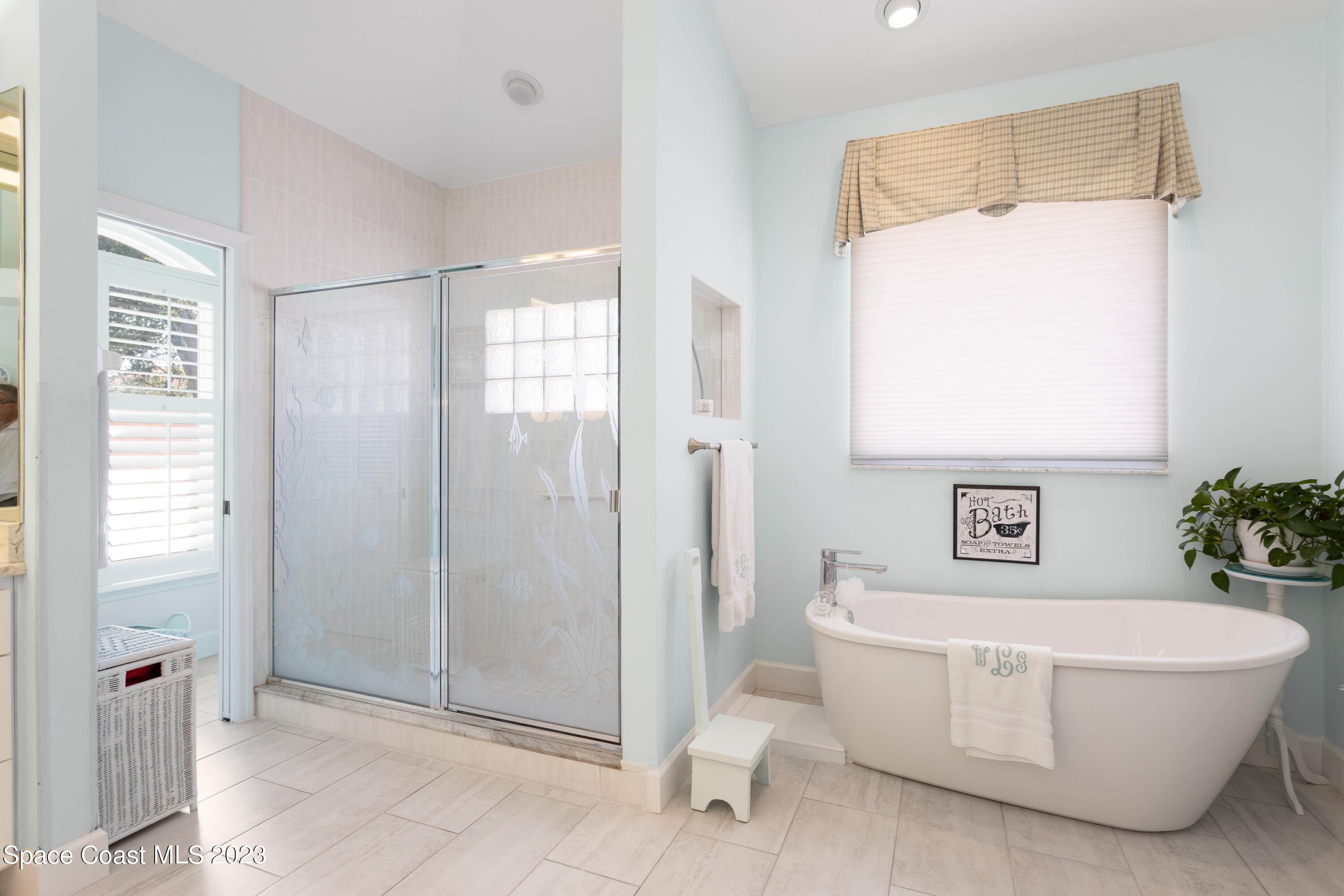 442 Sanderling Drive Indialantic, FL 32903 - Photo 24 of 45 a bathroom with a white tub and shower