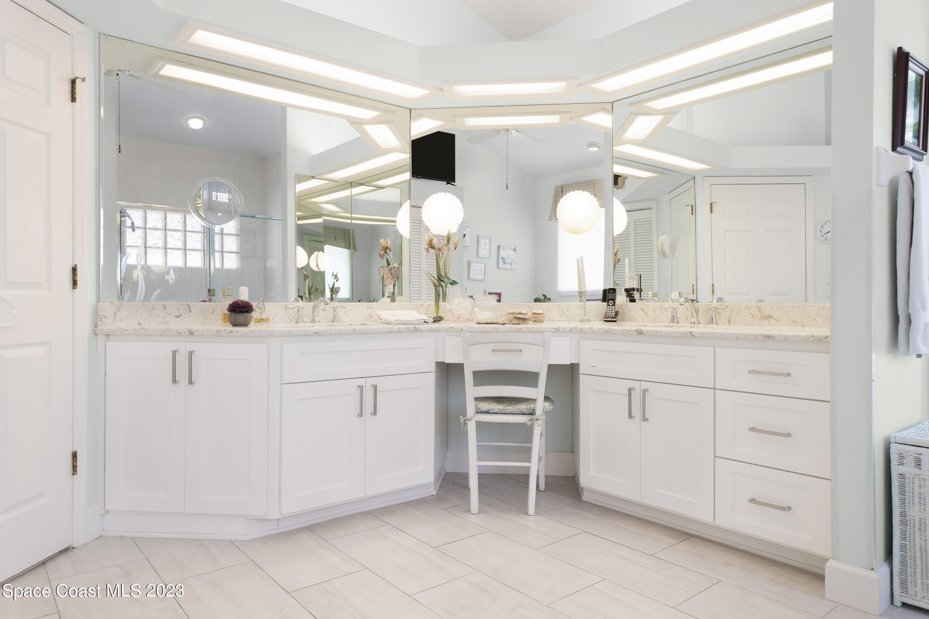 442 Sanderling Drive Indialantic, FL 32903 - Photo 25 of 45 a bathroom with a sink and a mirror