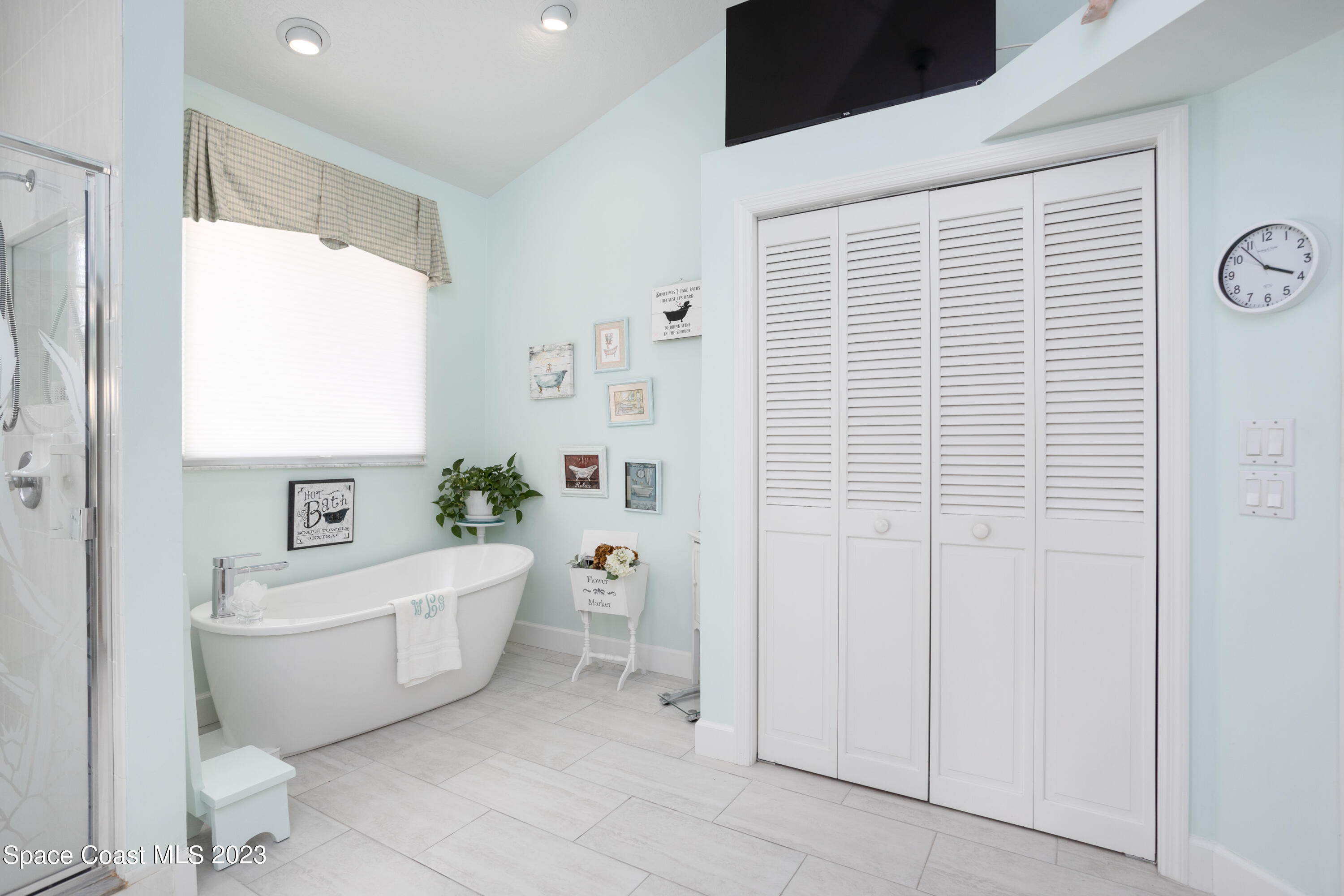 442 Sanderling Drive Indialantic, FL 32903 - Photo 26 of 45 a bathroom with a bathtub a toilet and a shower