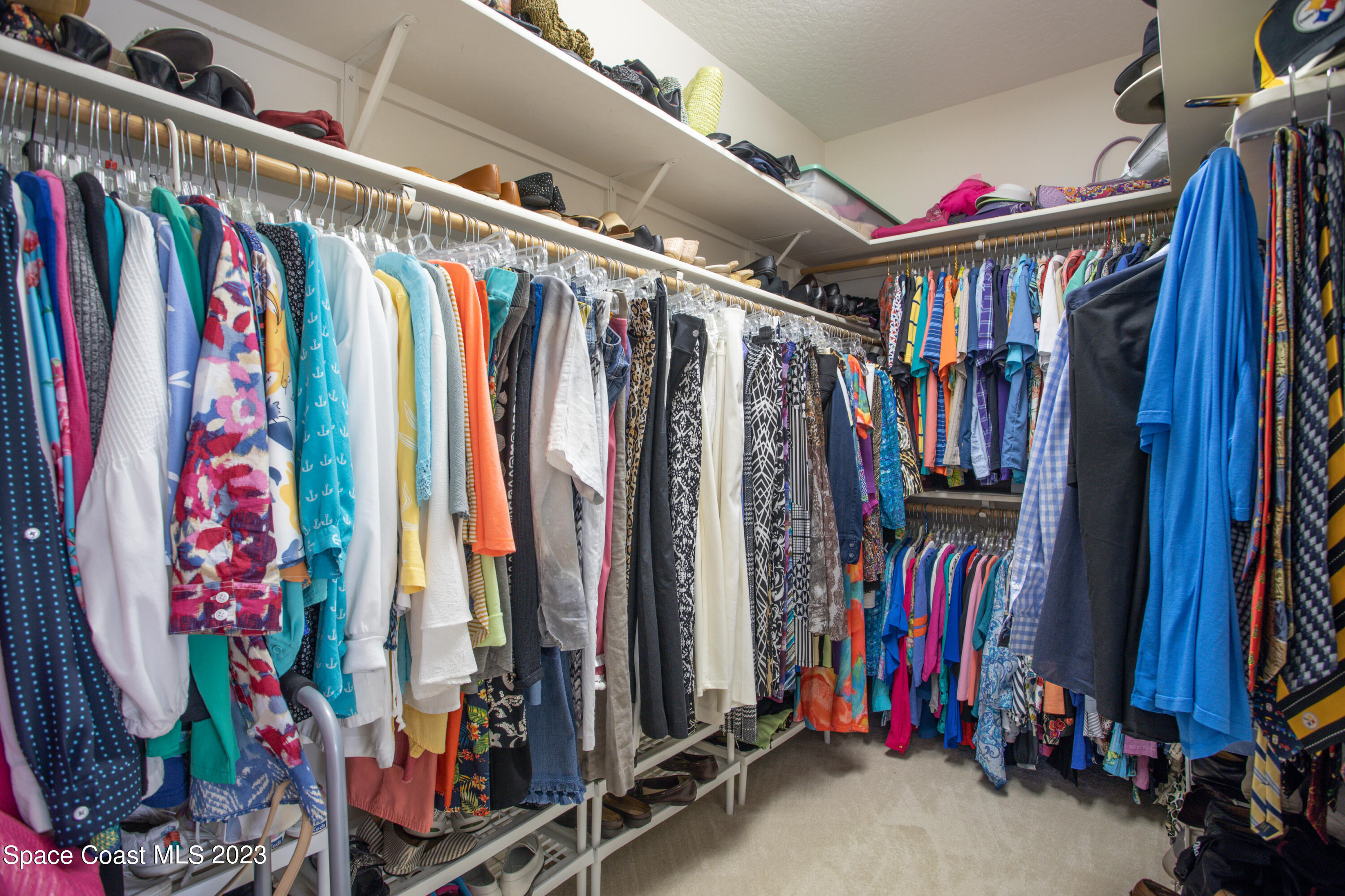 442 Sanderling Drive Indialantic, FL 32903 - Photo 27 of 45 a view of walk in closet with clothes