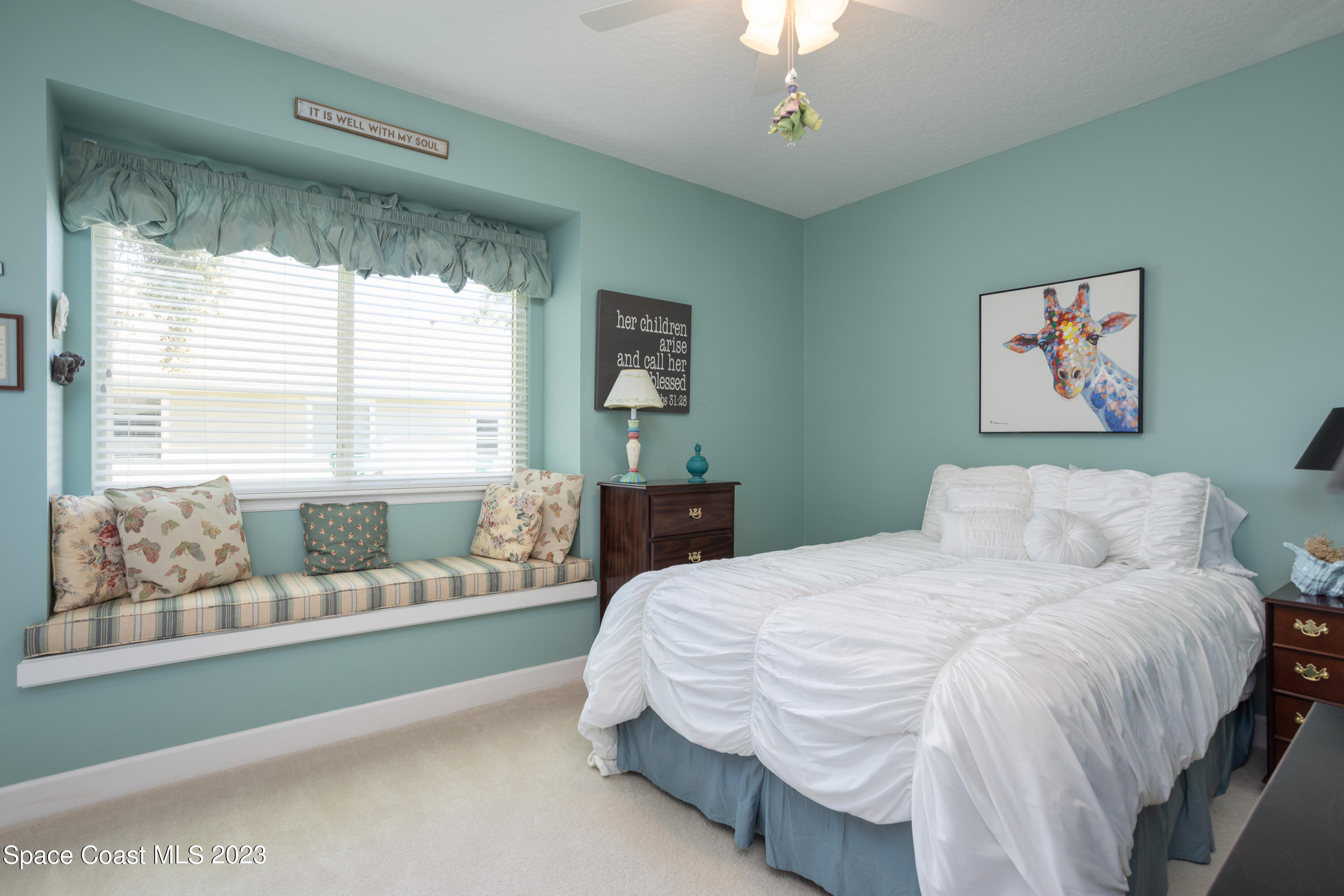 442 Sanderling Drive Indialantic, FL 32903 - Photo 28 of 45 a bedroom with a bed and glass window