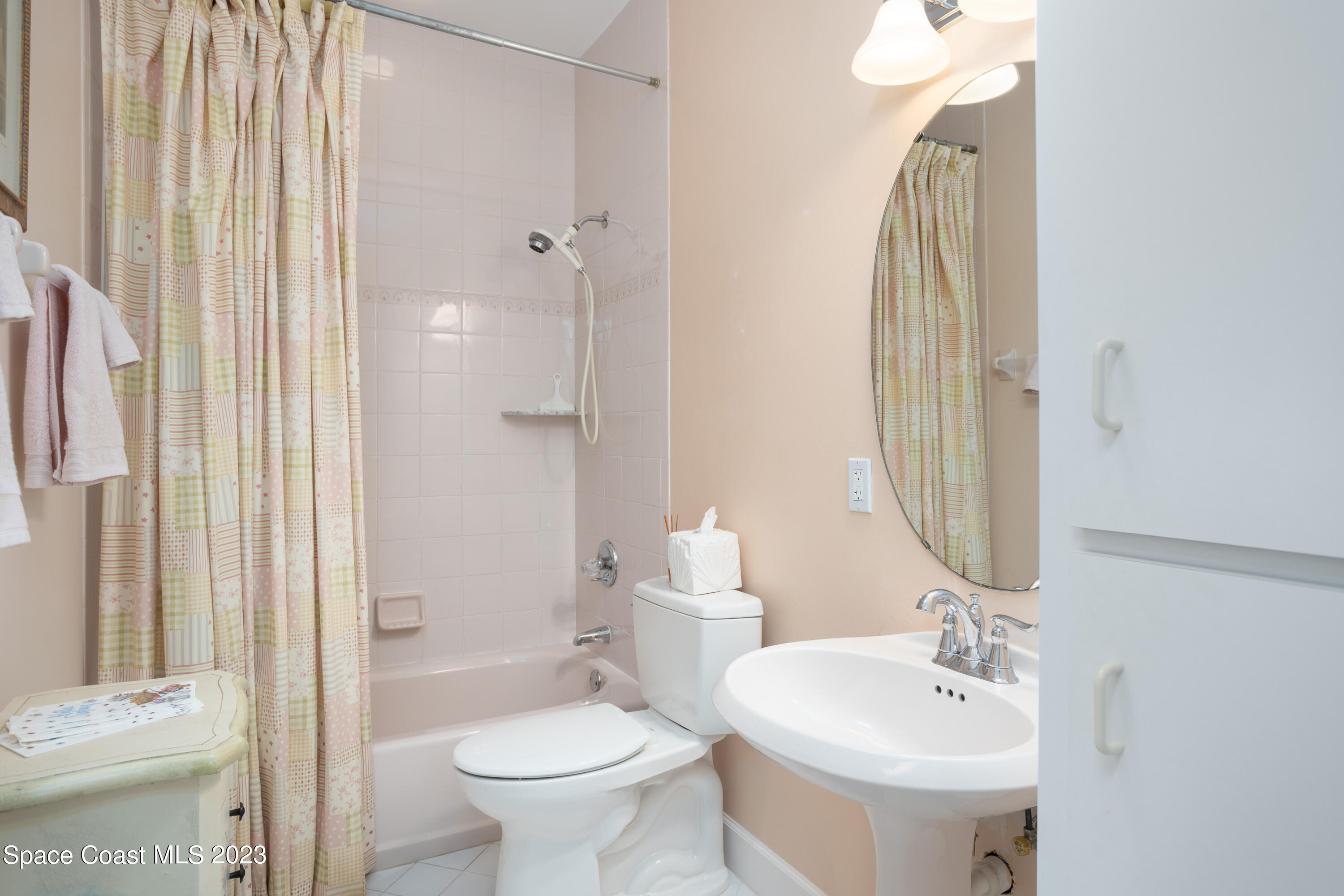 442 Sanderling Drive Indialantic, FL 32903 - Photo 30 of 45 a bathroom with a sink toilet and shower