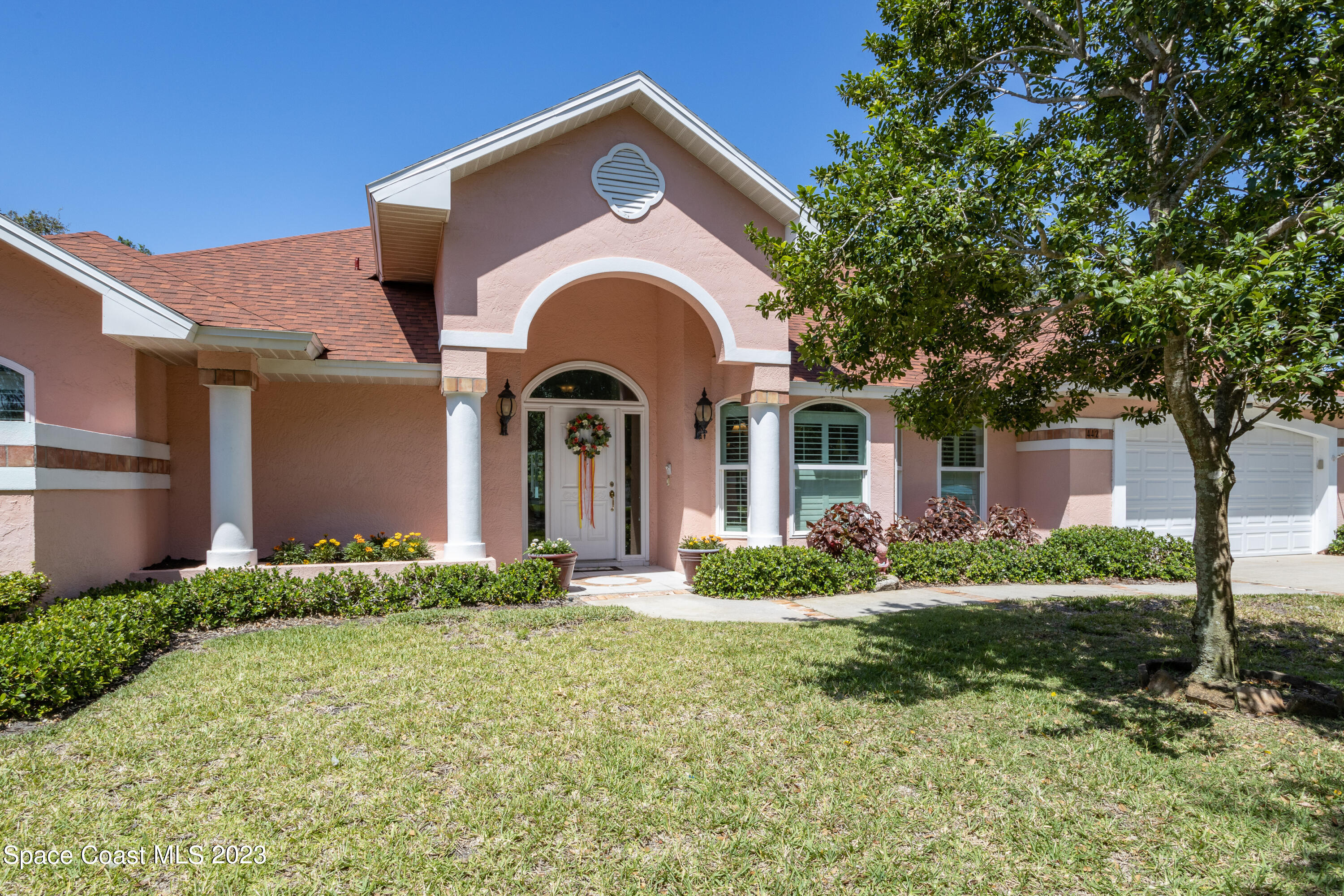442 Sanderling Drive Indialantic, FL 32903 - Photo 3 of 45 a front view of a house with garden