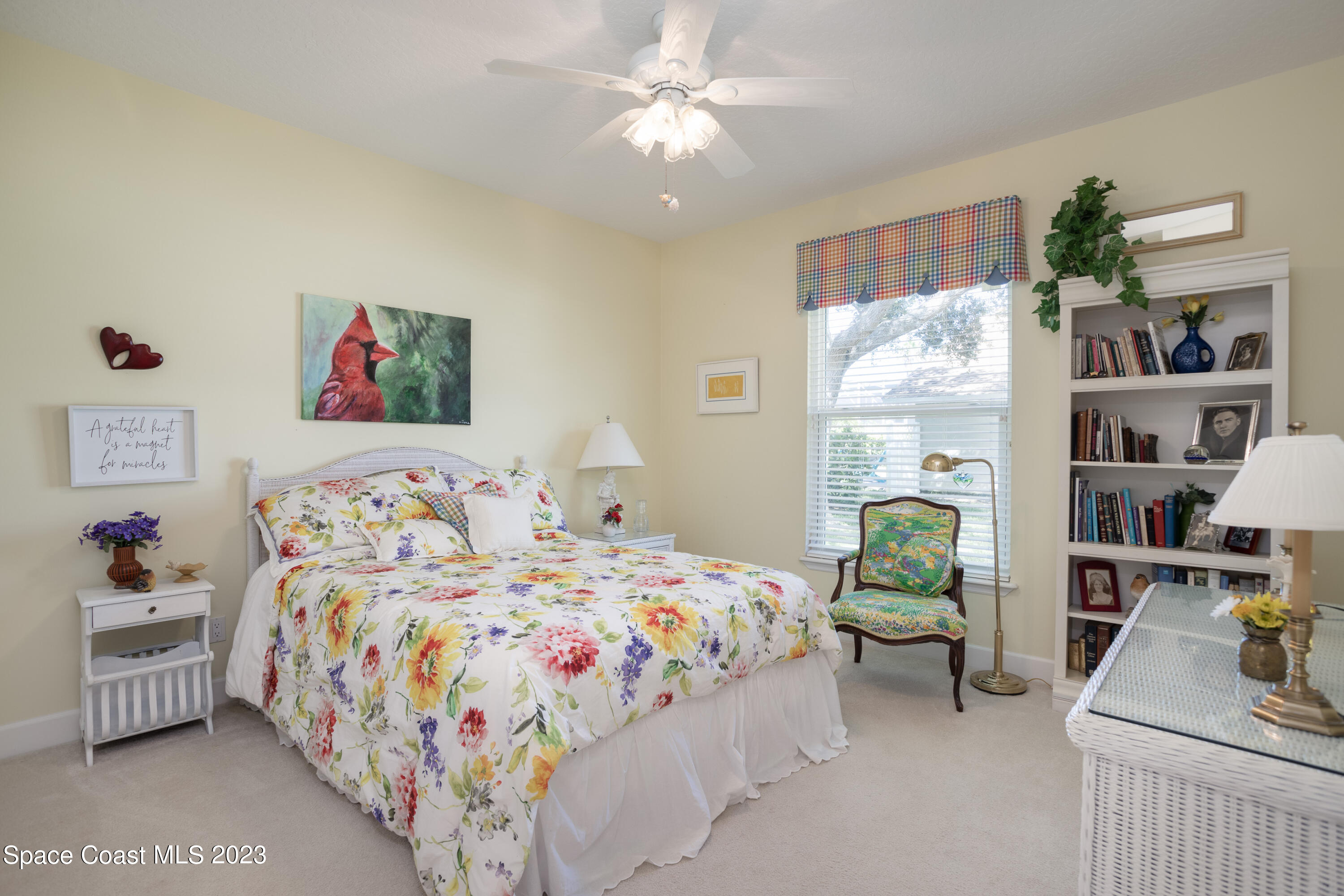 442 Sanderling Drive Indialantic, FL 32903 - Photo 31 of 45 a bedroom that has a bed and a bookshelf in it