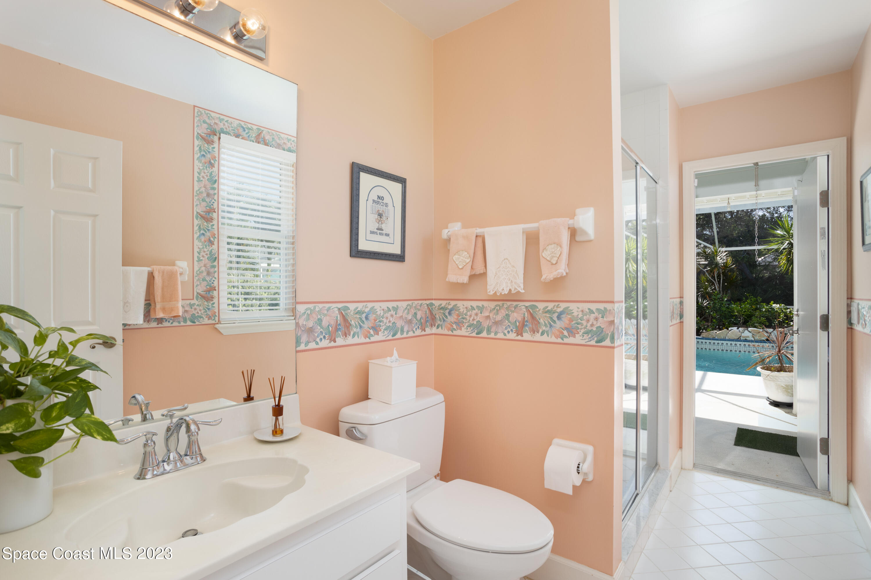 442 Sanderling Drive Indialantic, FL 32903 - Photo 33 of 45 a bathroom with a sink a toilet and shower