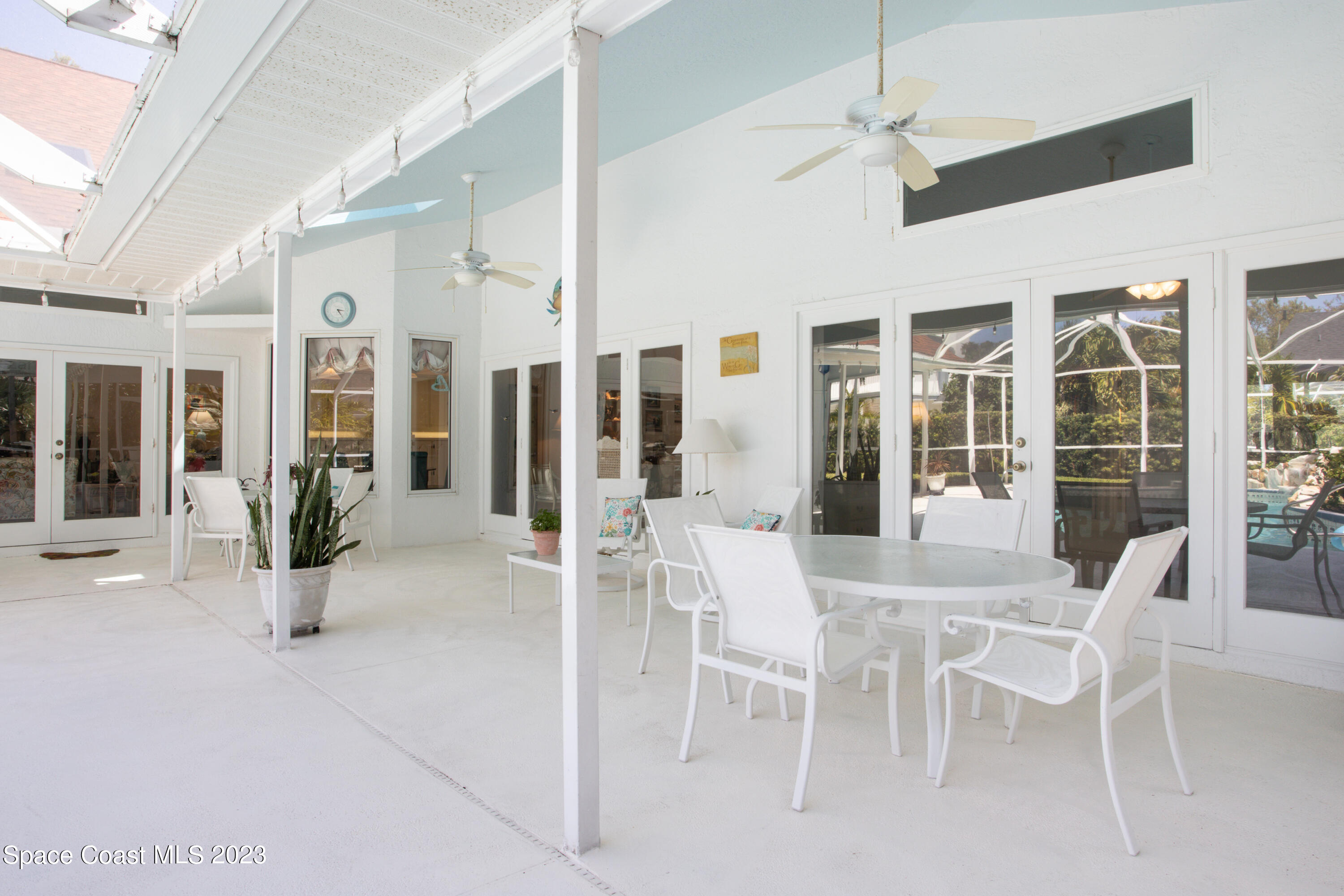 442 Sanderling Drive Indialantic, FL 32903 - Photo 37 of 45 a view of a dining room with furniture windows and wooden floor