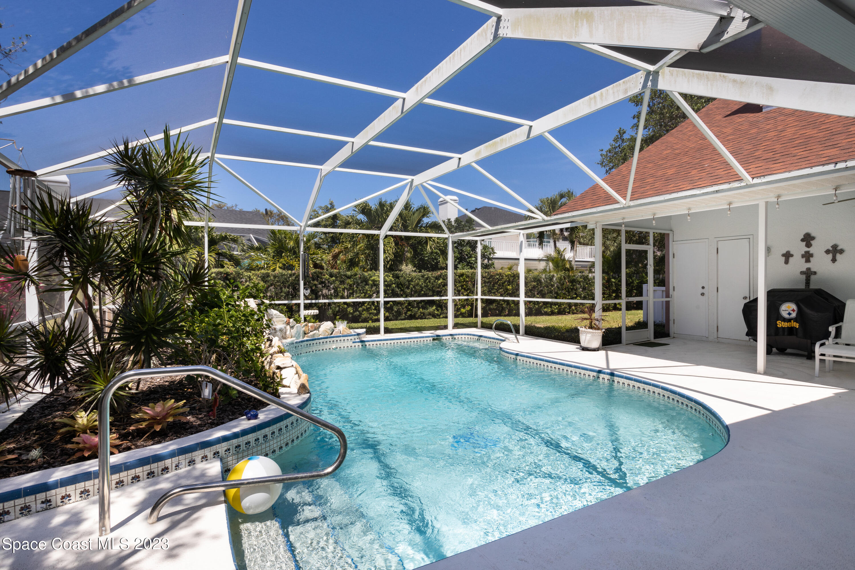 442 Sanderling Drive Indialantic, FL 32903 - Photo 4 of 45 a view of a backyard with swimming pool and sitting area