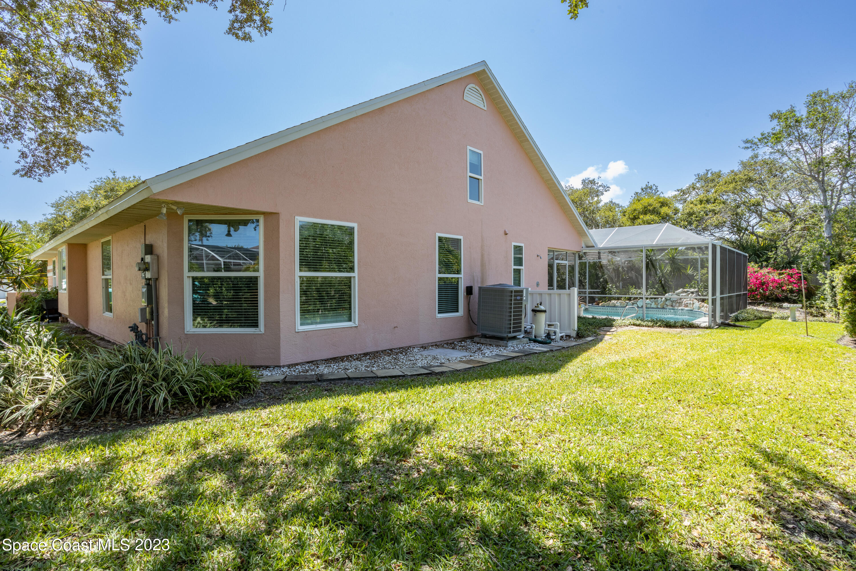 442 Sanderling Drive Indialantic, FL 32903 - Photo 42 of 45 a view of house with backyard and swimming pool