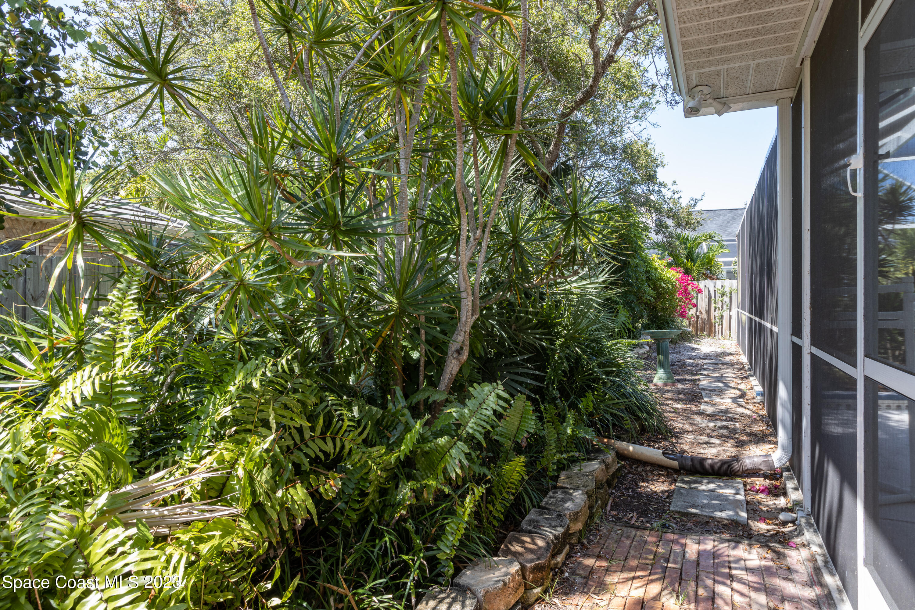 442 Sanderling Drive Indialantic, FL 32903 - Photo 43 of 45 a view of a yard with plants