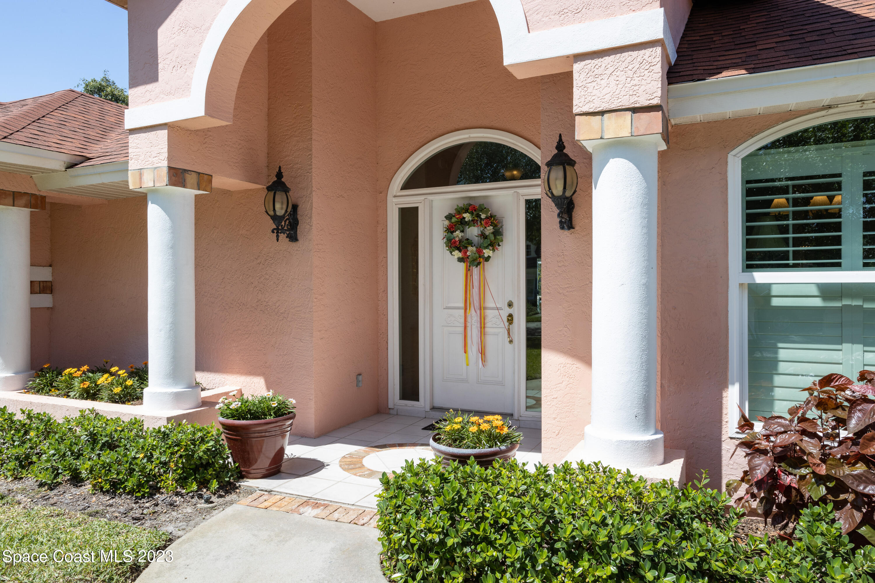 442 Sanderling Drive Indialantic, FL 32903 - Photo 5 of 45 a front view of a house with a yard