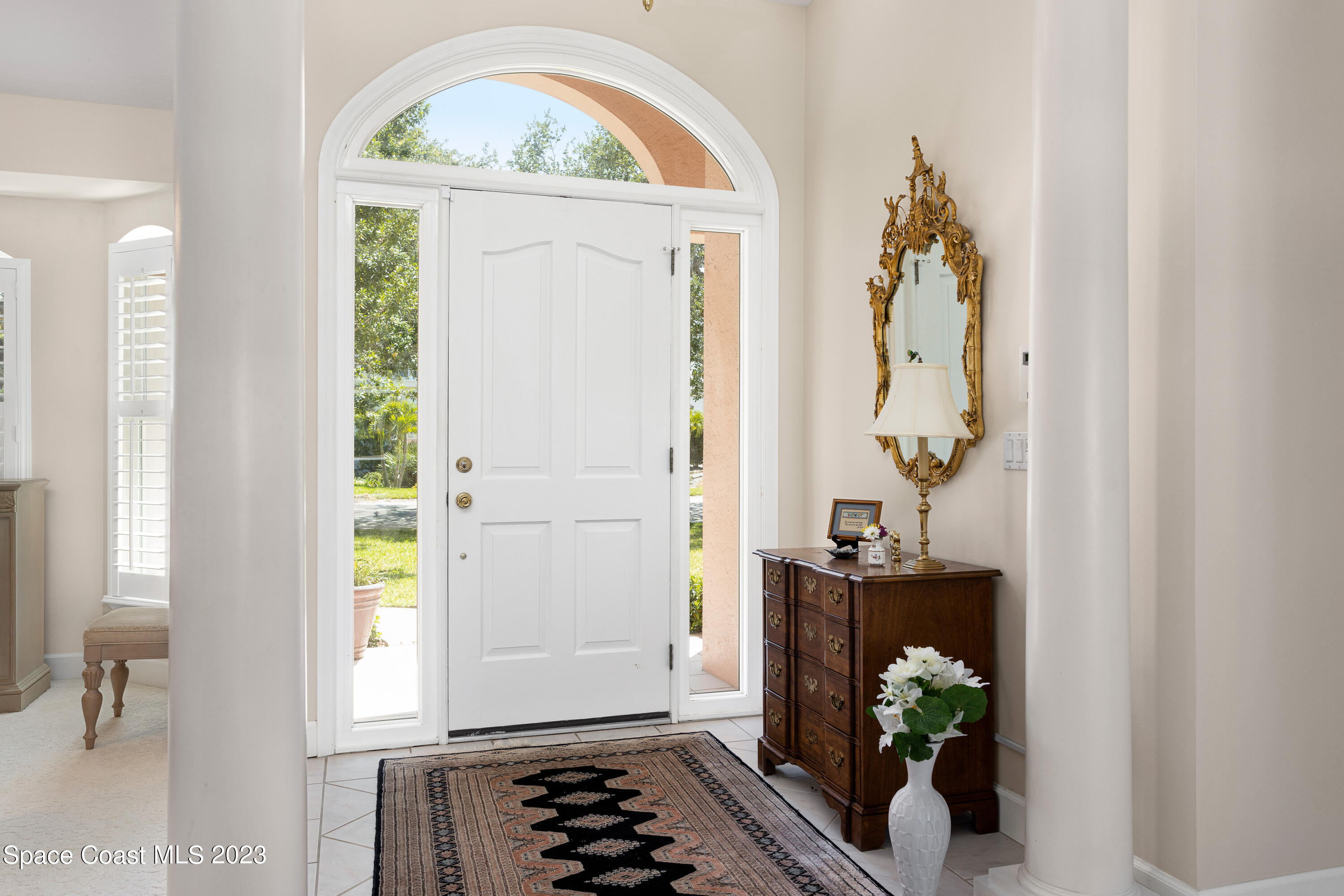 442 Sanderling Drive Indialantic, FL 32903 - Photo 6 of 45 a room with toys and wooden door