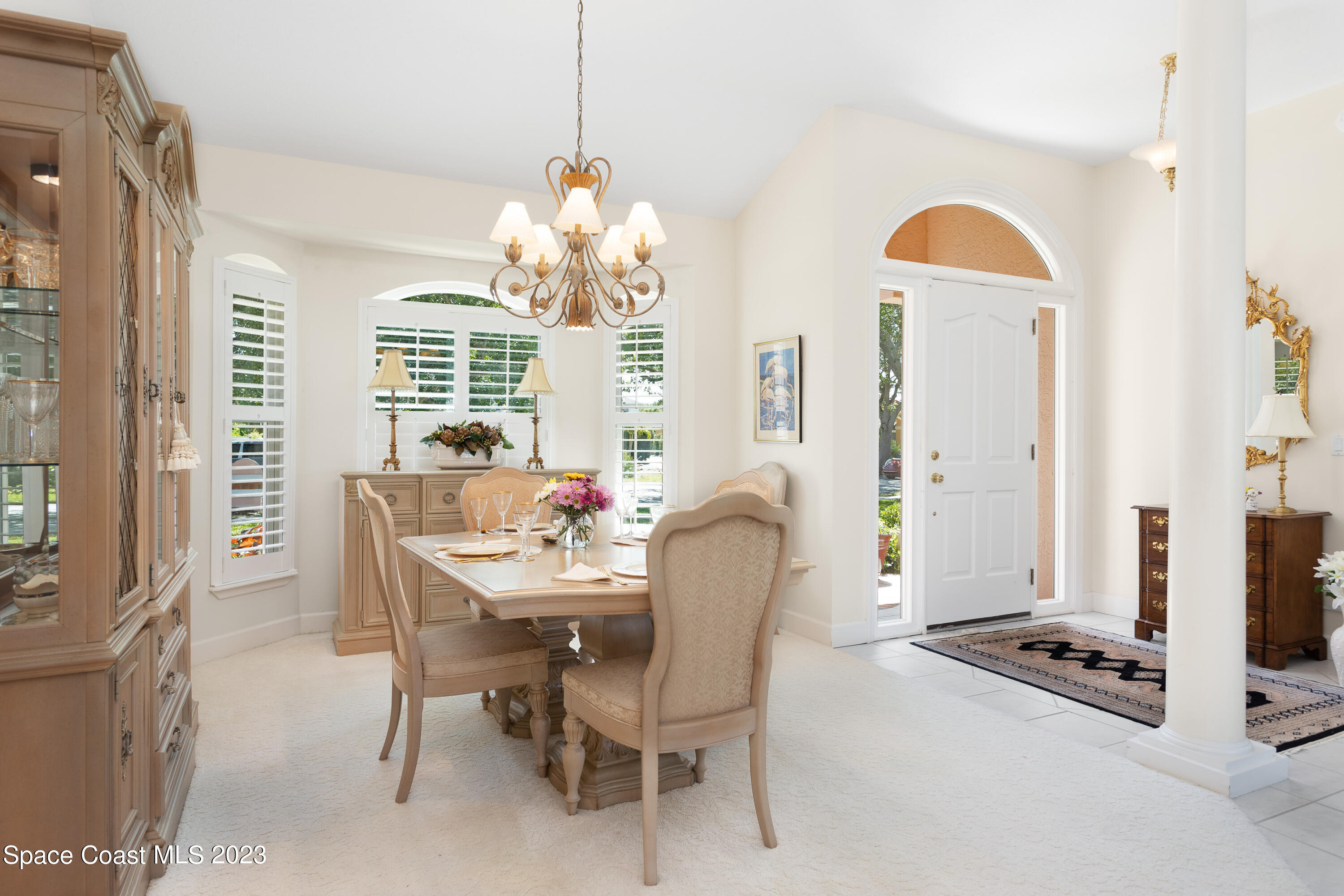 442 Sanderling Drive Indialantic, FL 32903 - Photo 8 of 45 a dining room with furniture and window