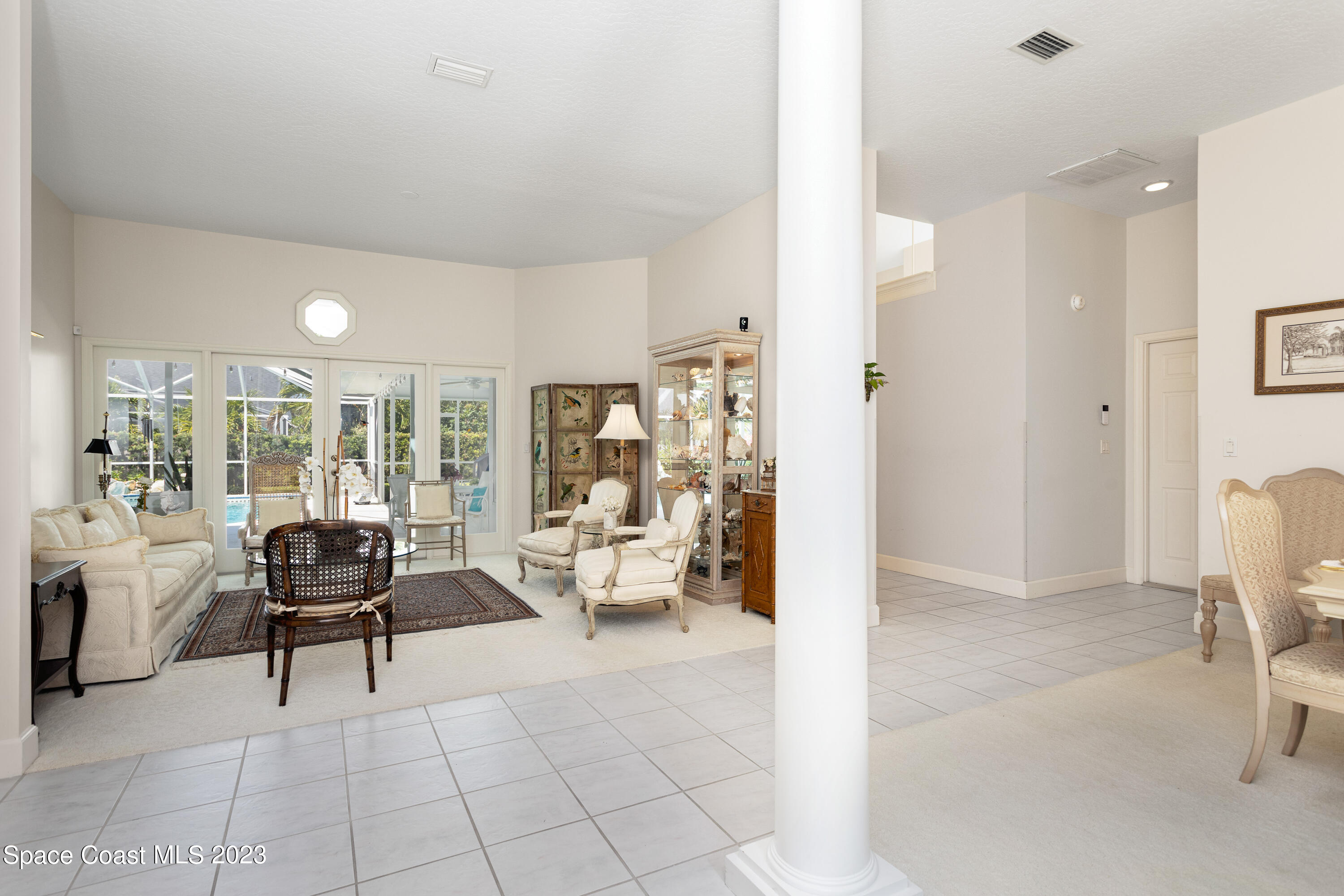442 Sanderling Drive Indialantic, FL 32903 - Photo 9 of 45 a living room with furniture and a large window