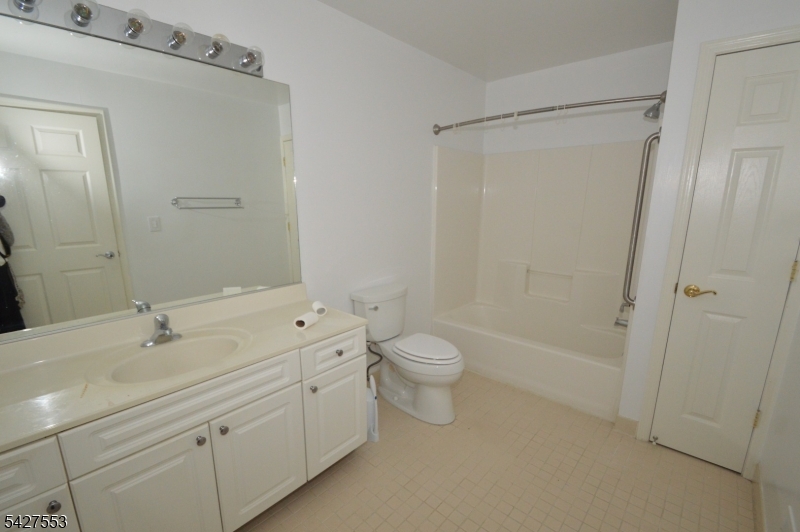 1 Jenny Lind Street, Unit 29 Netcong, NJ 07857 - Photo 12 of 13 a bathroom with a double vanity sink toilet and shower