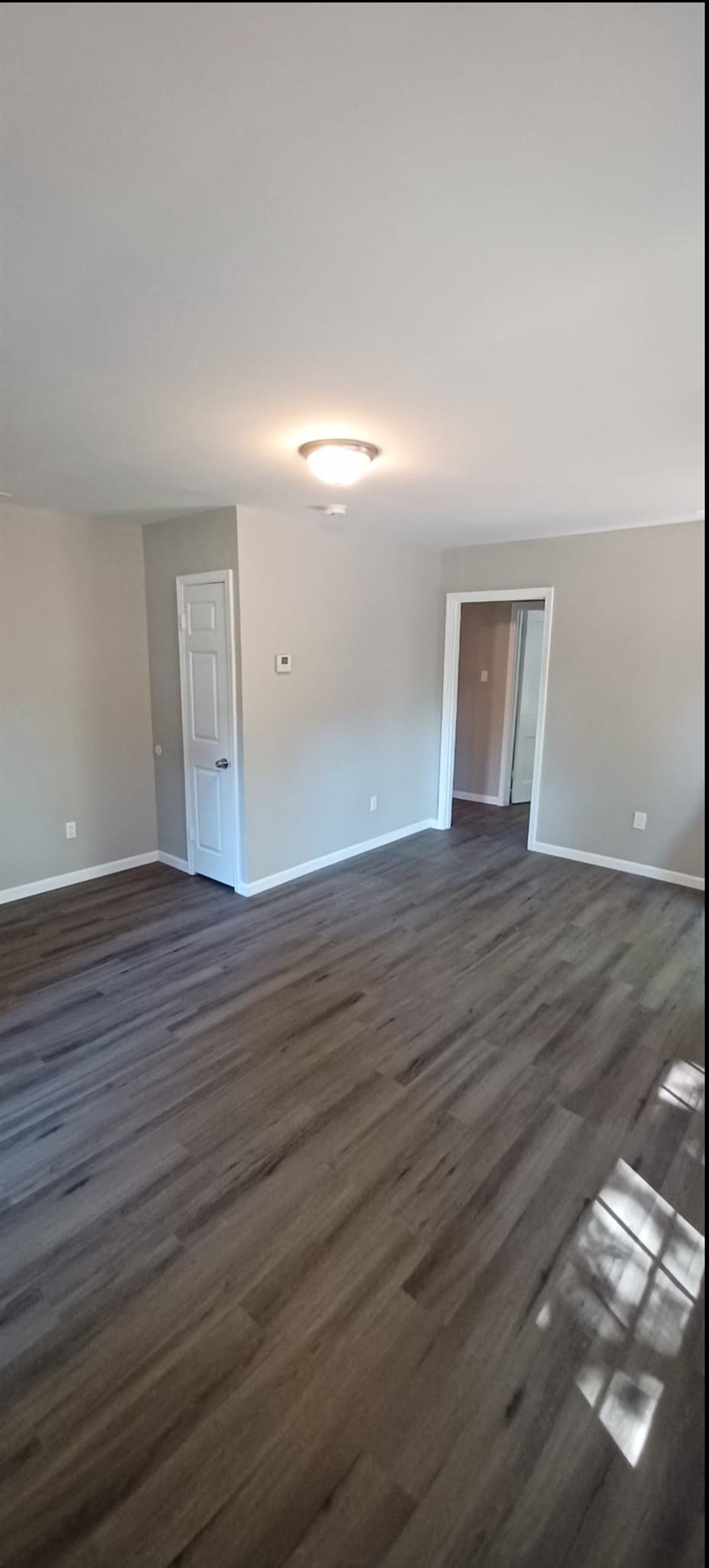 3189 Morningside Street Memphis, TN 38127 - Photo 13 of 14 a view of an empty room and wooden floor