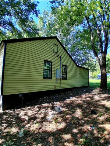 a view of a house with a tree