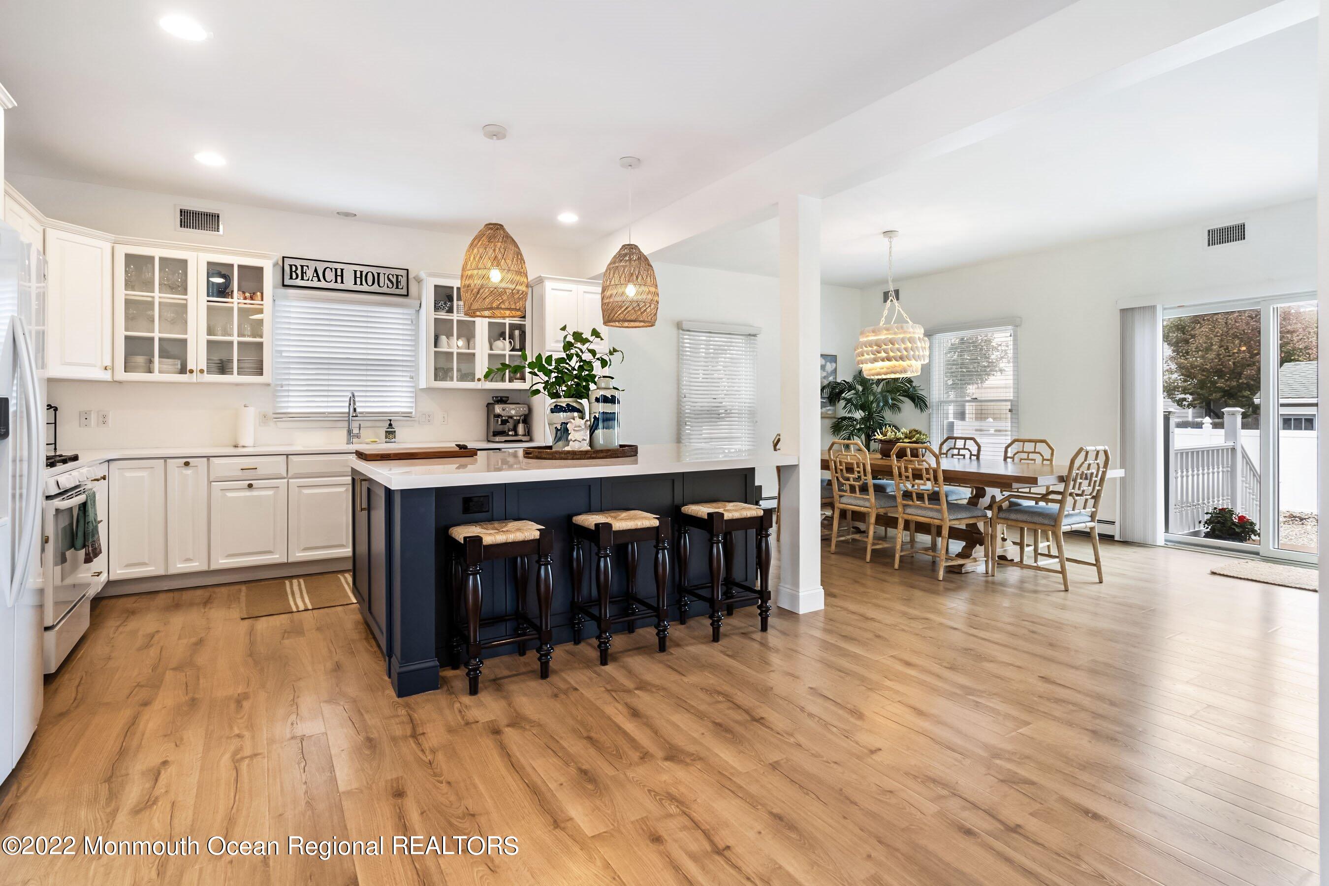 23 Magee Avenue, Unit SUMMER Lavallette, NJ 08735 - Photo 11 of 34 a view of a kitchen with dining room and wooden floor