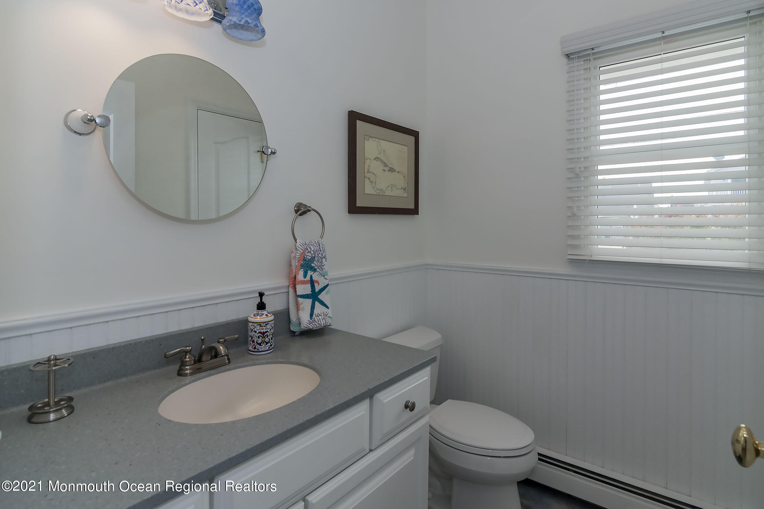 23 Magee Avenue, Unit SUMMER Lavallette, NJ 08735 - Photo 22 of 34 a bathroom with a granite countertop toilet a sink and a mirror